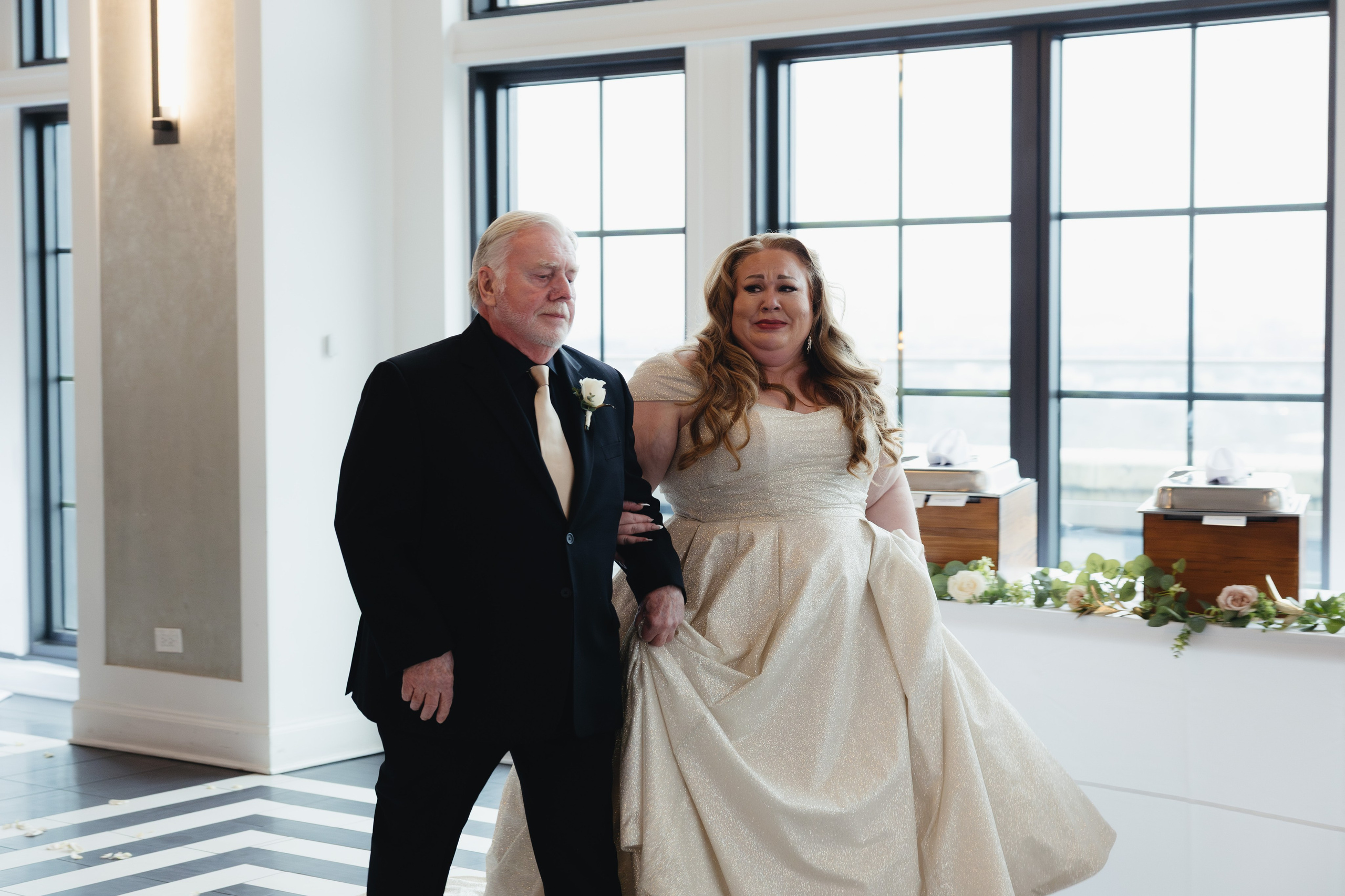 Bride walking down the aisle with her father during a wedding ceremony at The Penthouse Hyde Park in Chicago