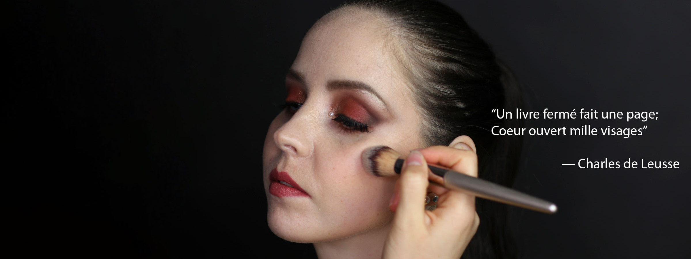 A photo of a woman while applying the make-up