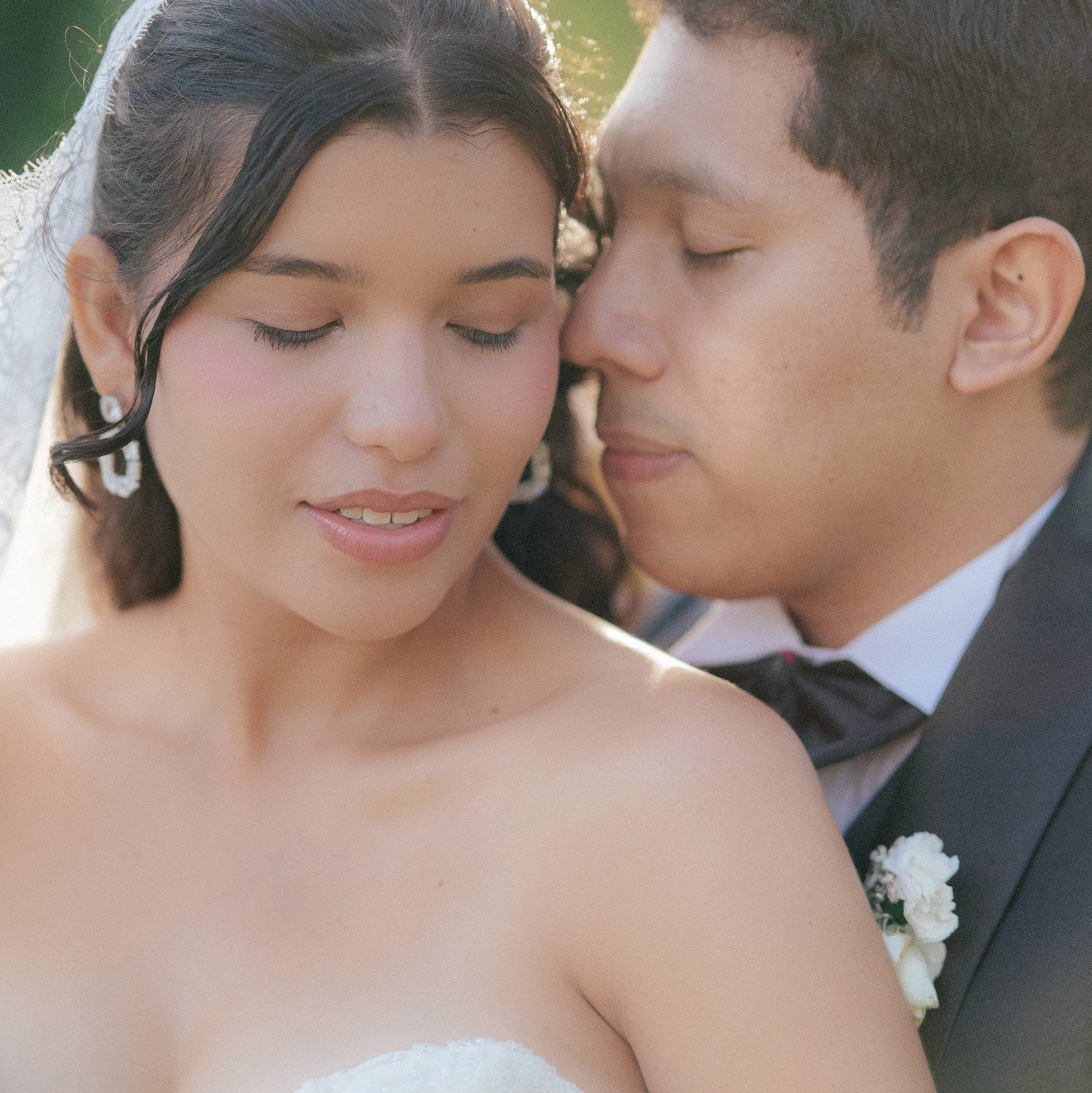 Bride and groom portrait – “Close-up portrait of bride and groom looking lovingly at each other, romantic wedding photography in Cartagena