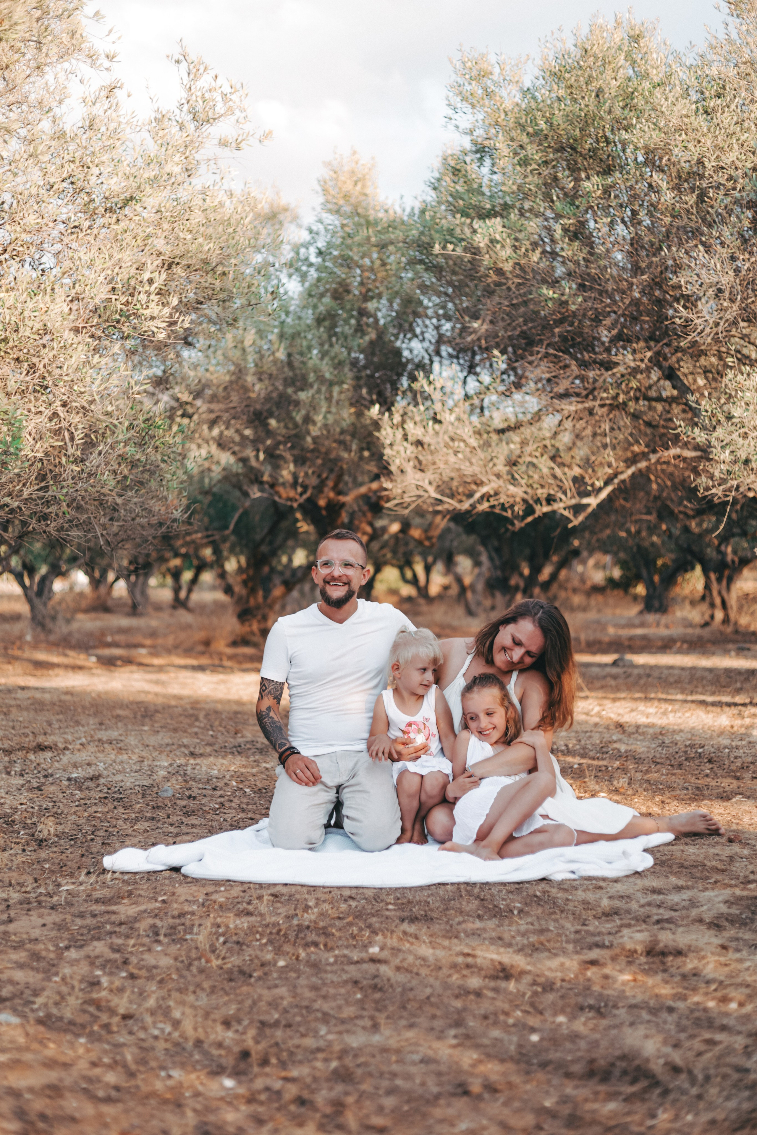 Happy family in a Cretan olive grove
