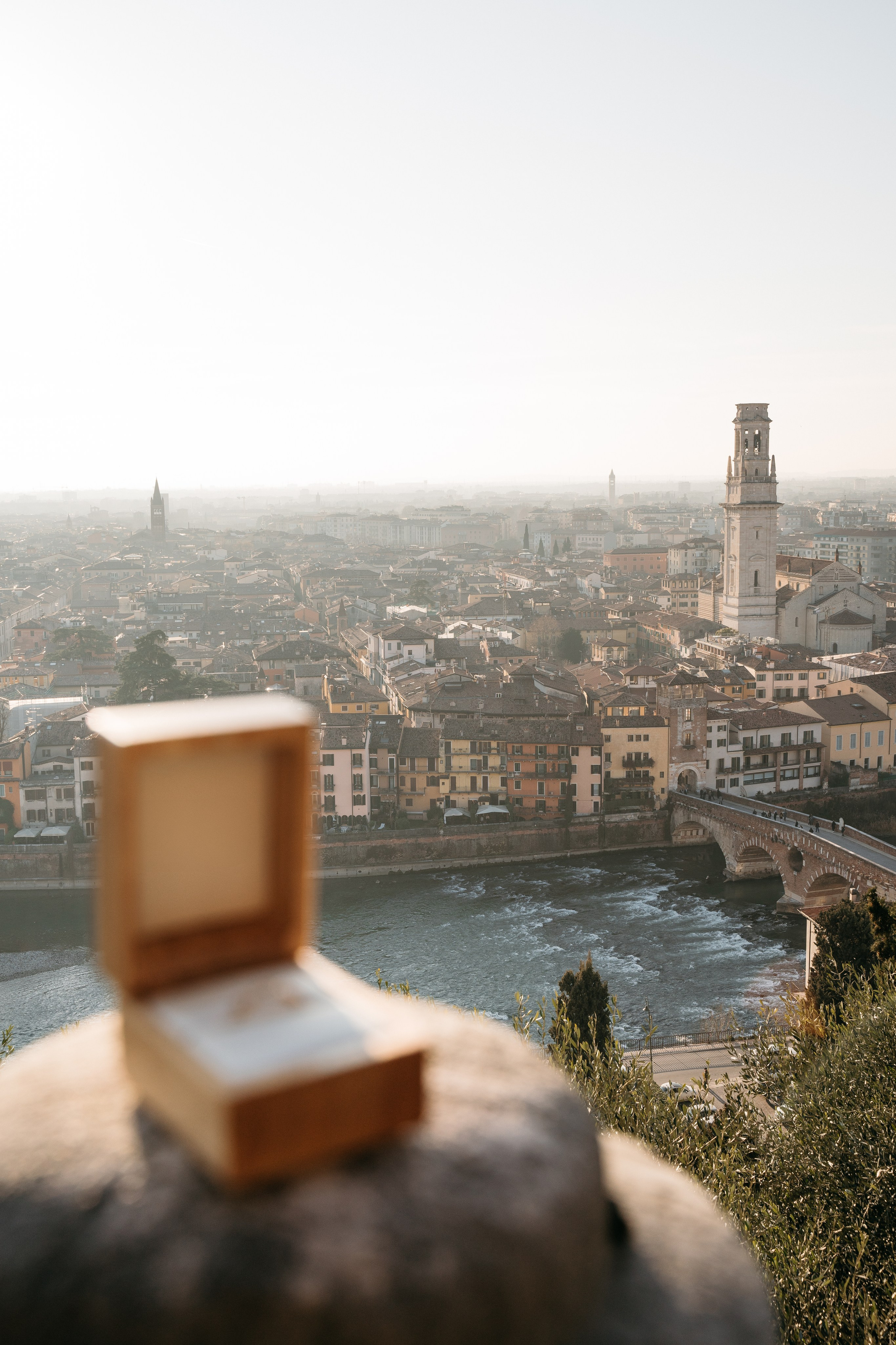 Romantic marriage proposal setup on a panoramic terrace in Verona overlooking the historic city center