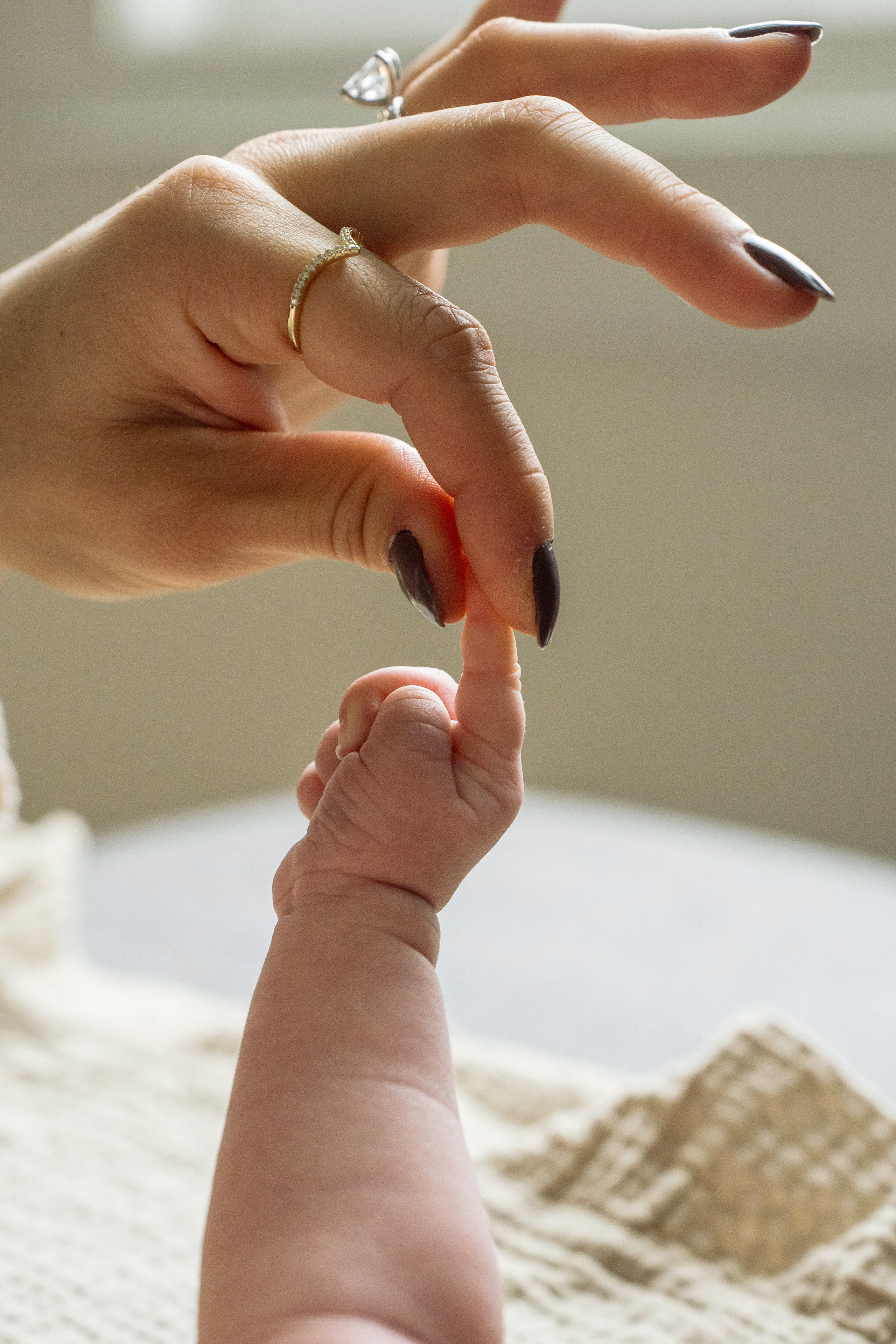 Lifestyle newborn photography capturing baby’s tiny hand in Bucks County, PA by Alisa Tant.