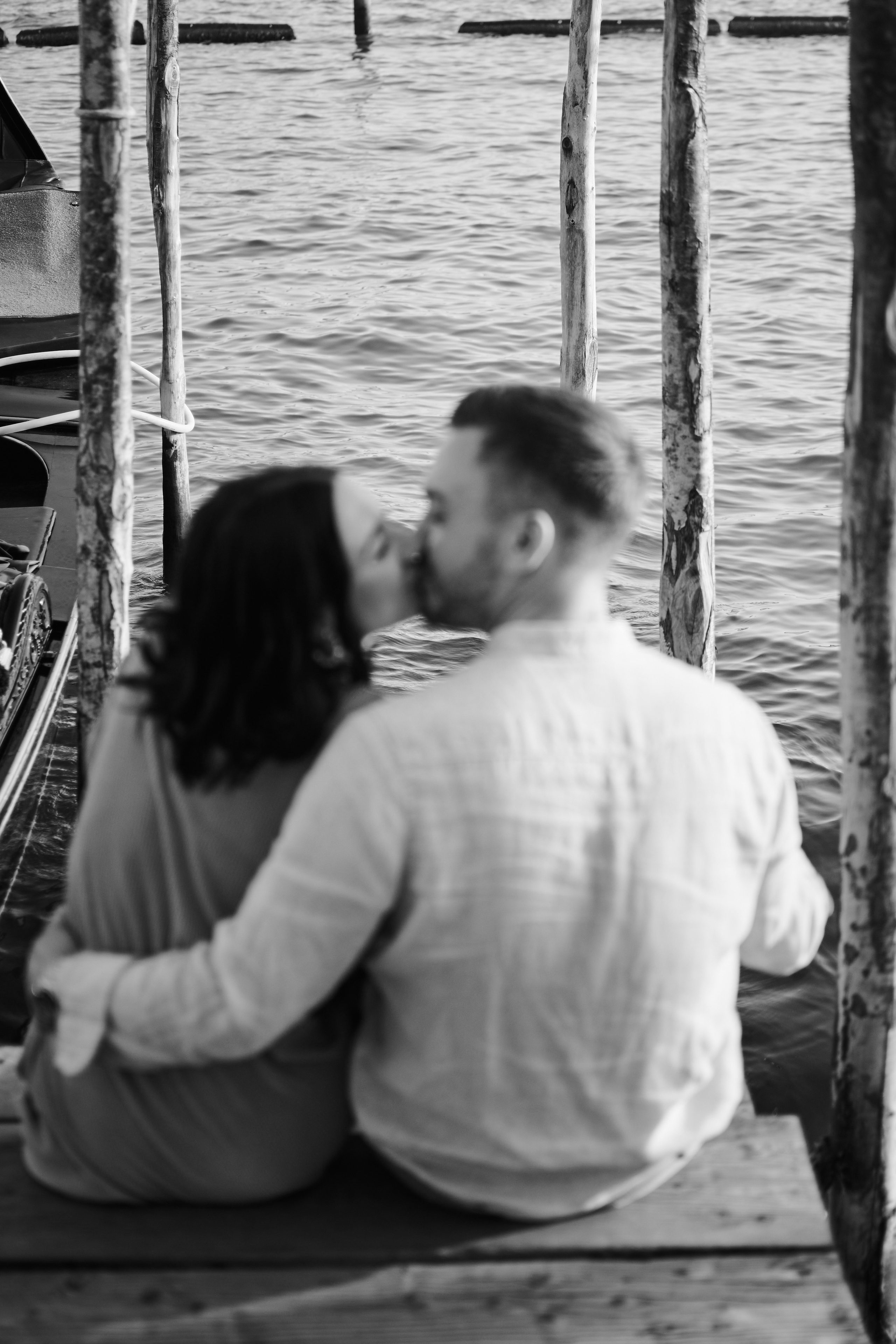 A stunning love story shoot takes place on San Marco Square, with the Bridge of Sighs providing an iconic backdrop. The couple is lost in each other's eyes, their love palpable in the photo. The photographer has expertly captured the essence of Venice's beauty, from the intricate stonework of the bridge to the stunning architecture of the surrounding buildings
