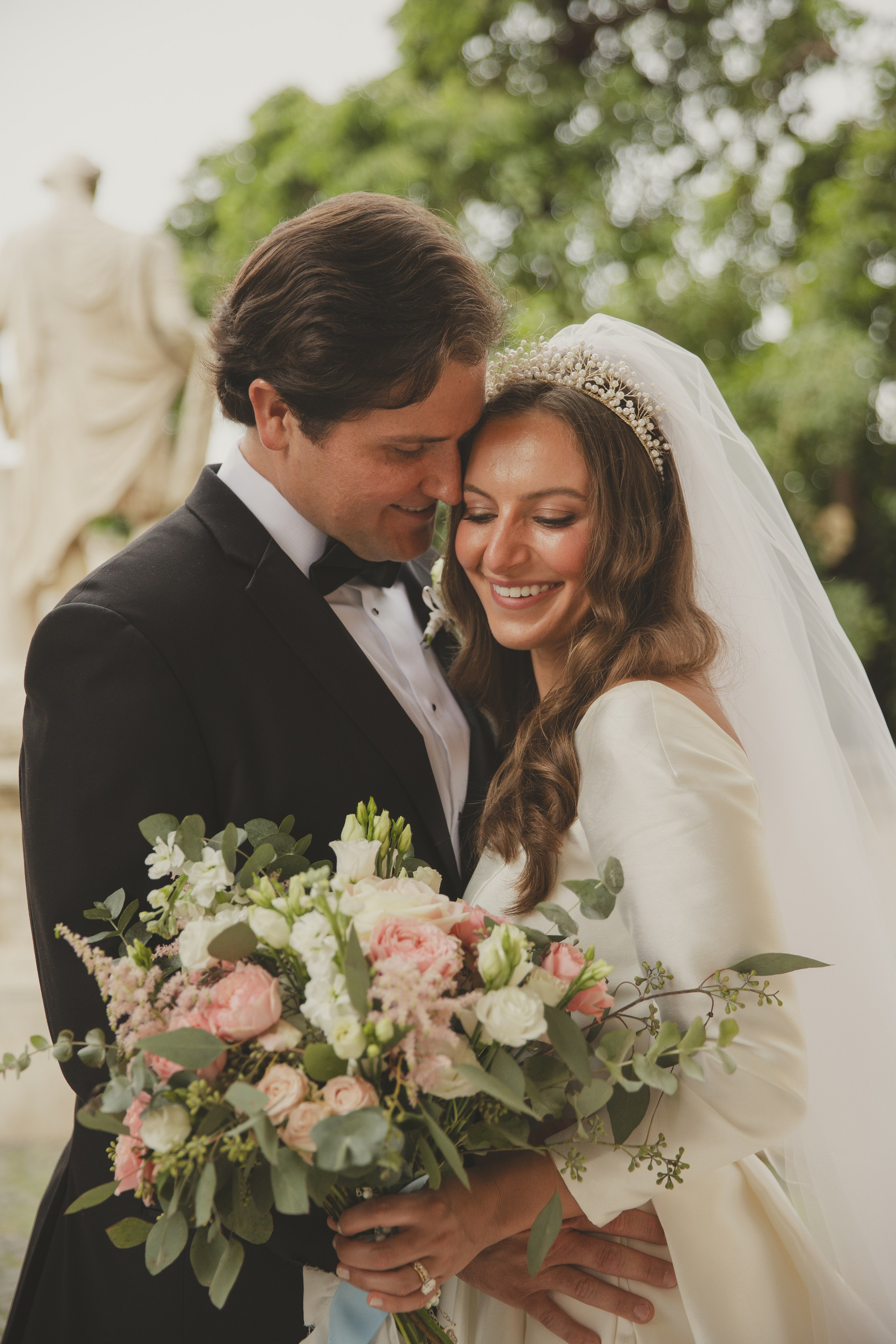 Newlyweds sharing a kiss in Rome Campiddoglio majestically in the background. Wedding Elopement