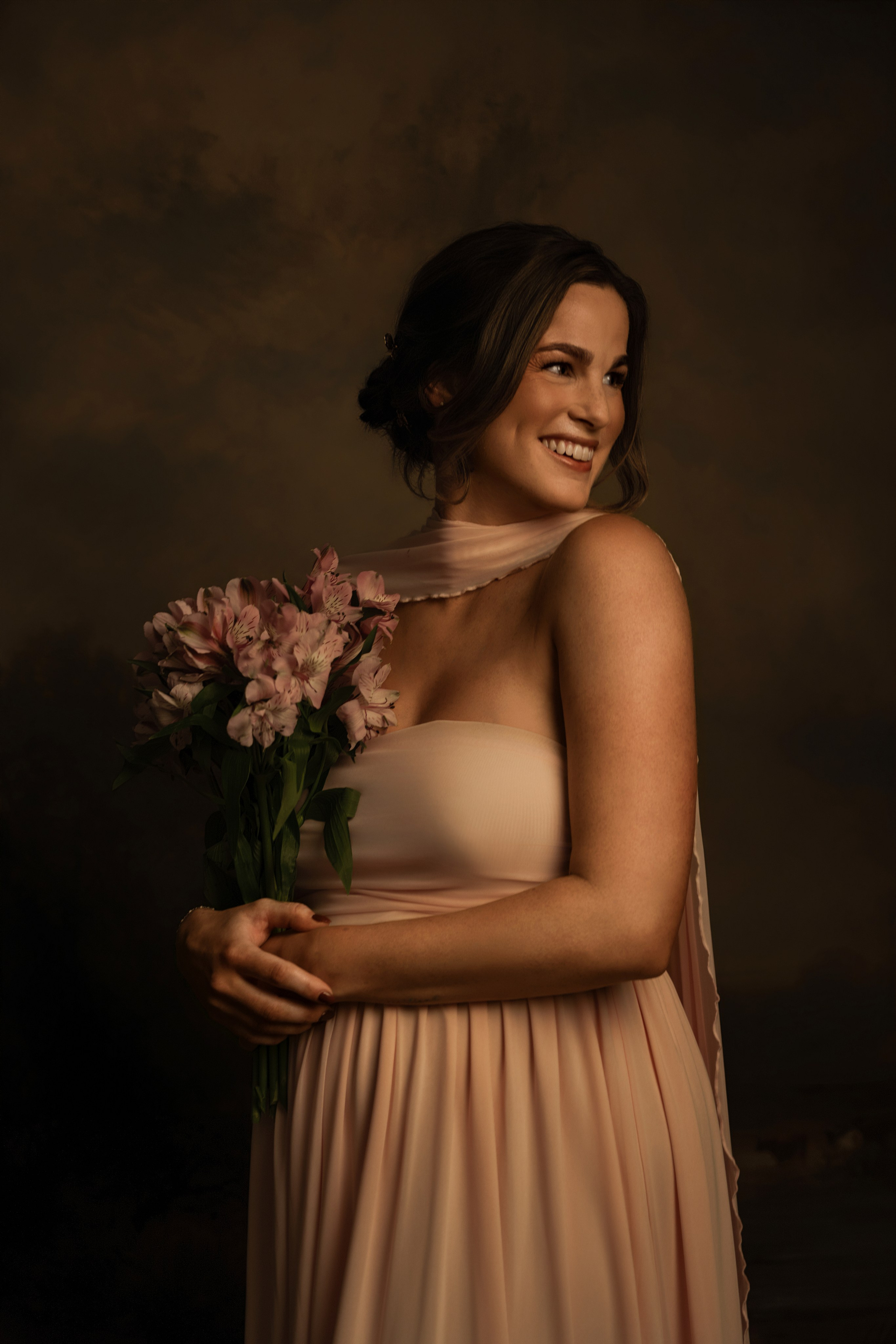 Expecting mother in a studio maternity portrait, the session that is usually booked at the same time as the newborn one