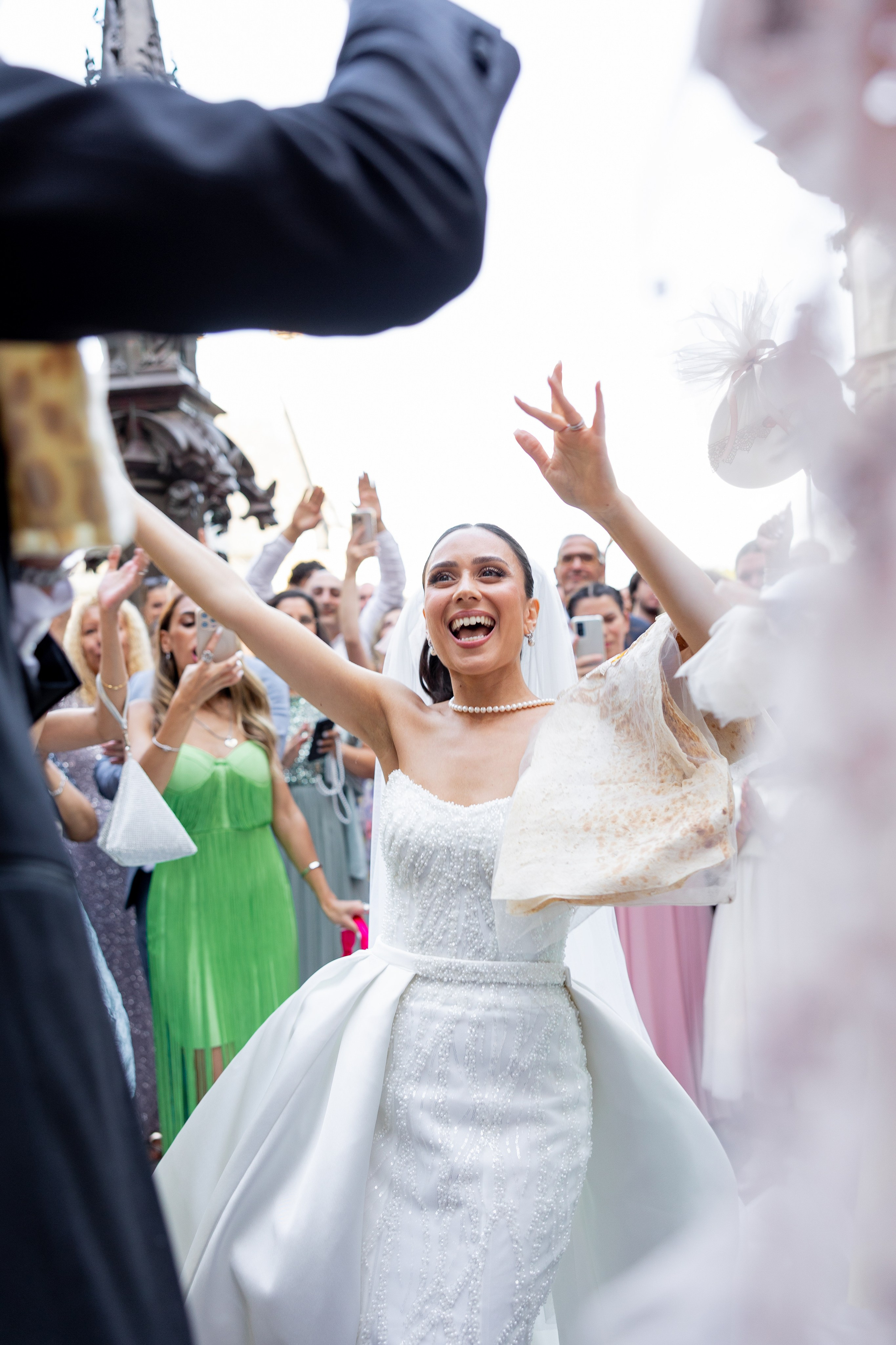Bride celebrating multicultural wedding Palais Bénédictine — Johnny Jo destination wedding photographer