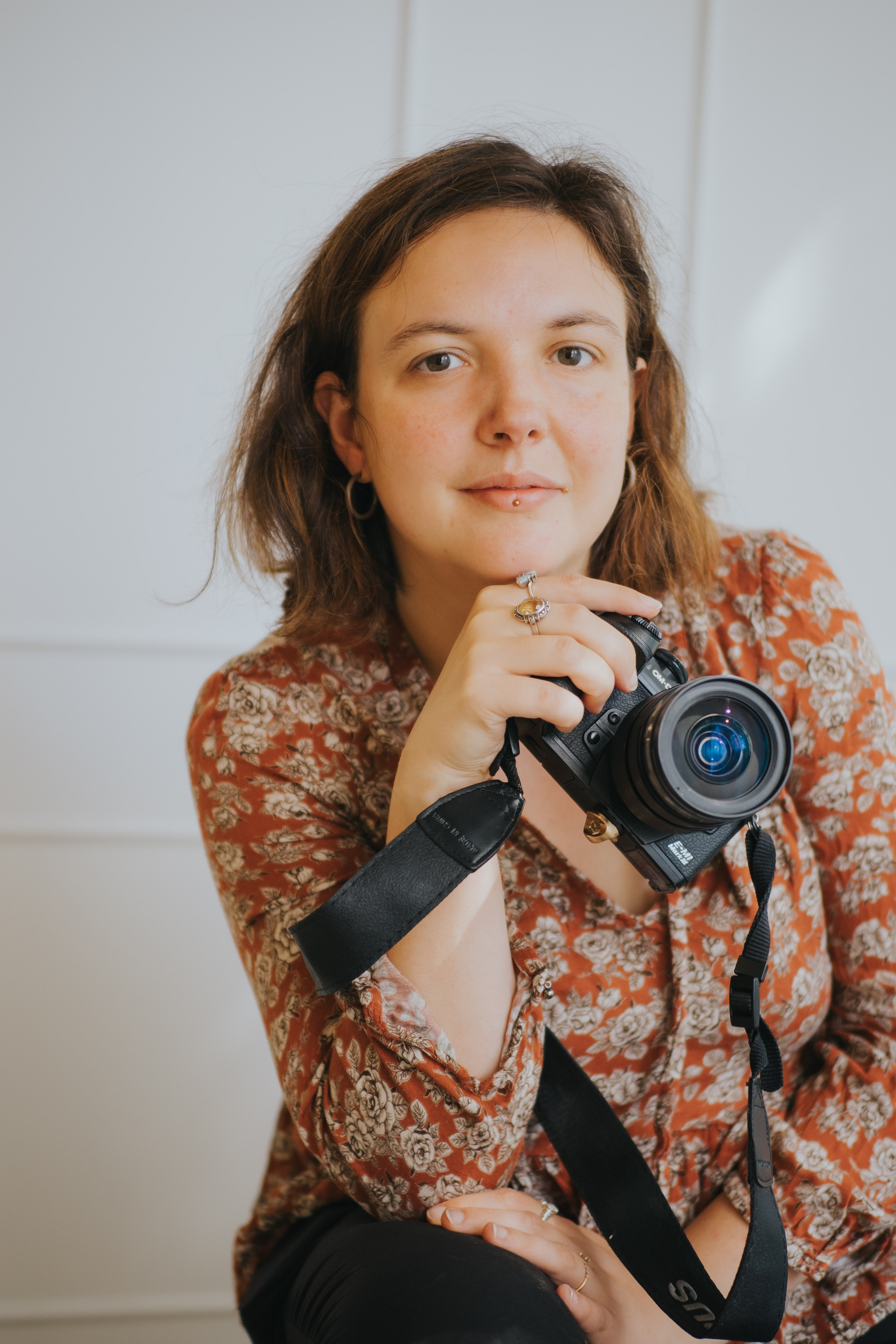 Picture of photographer holding a camera. 