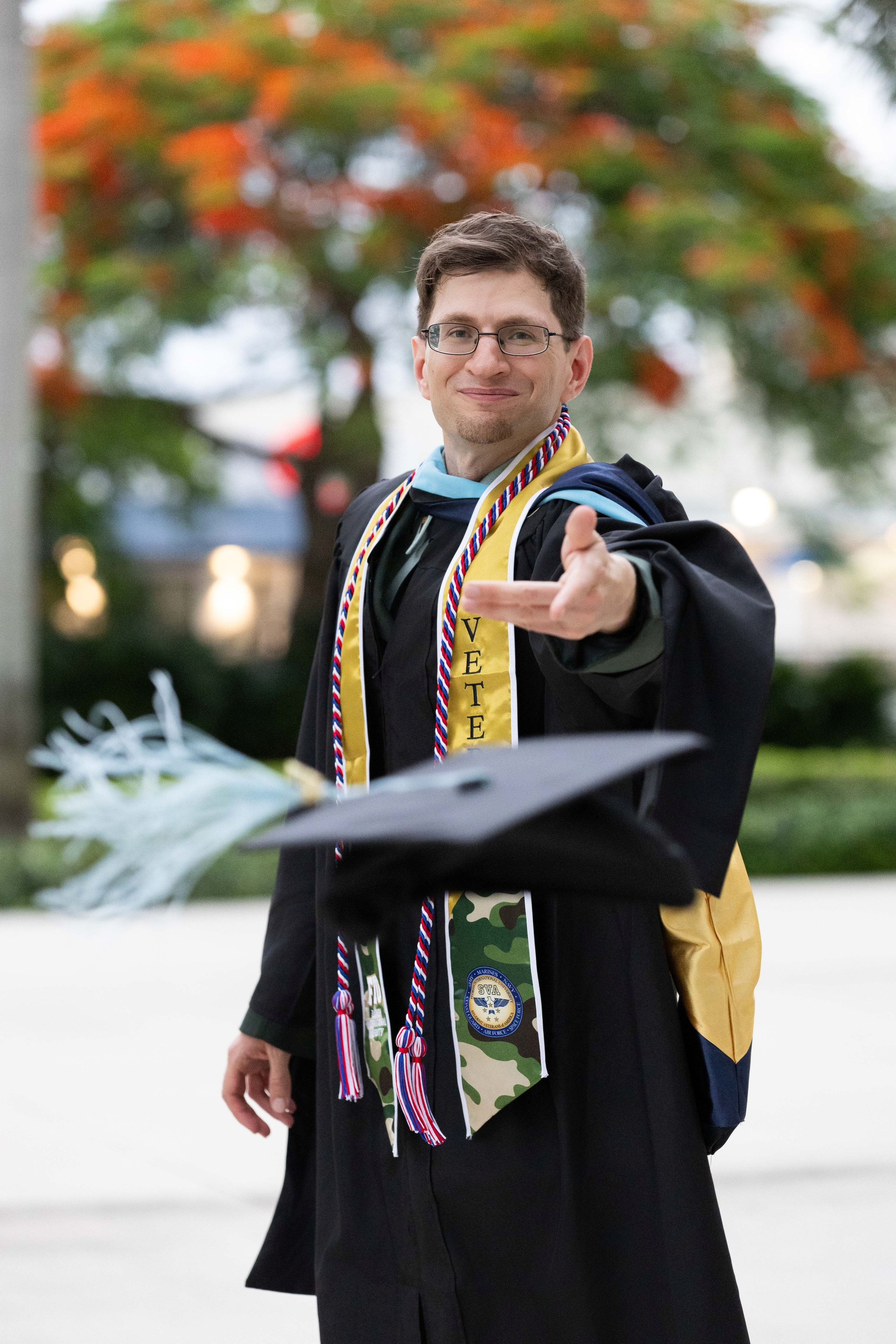 Darren tosses his graduation cap during an FIU Class of 2026 session.