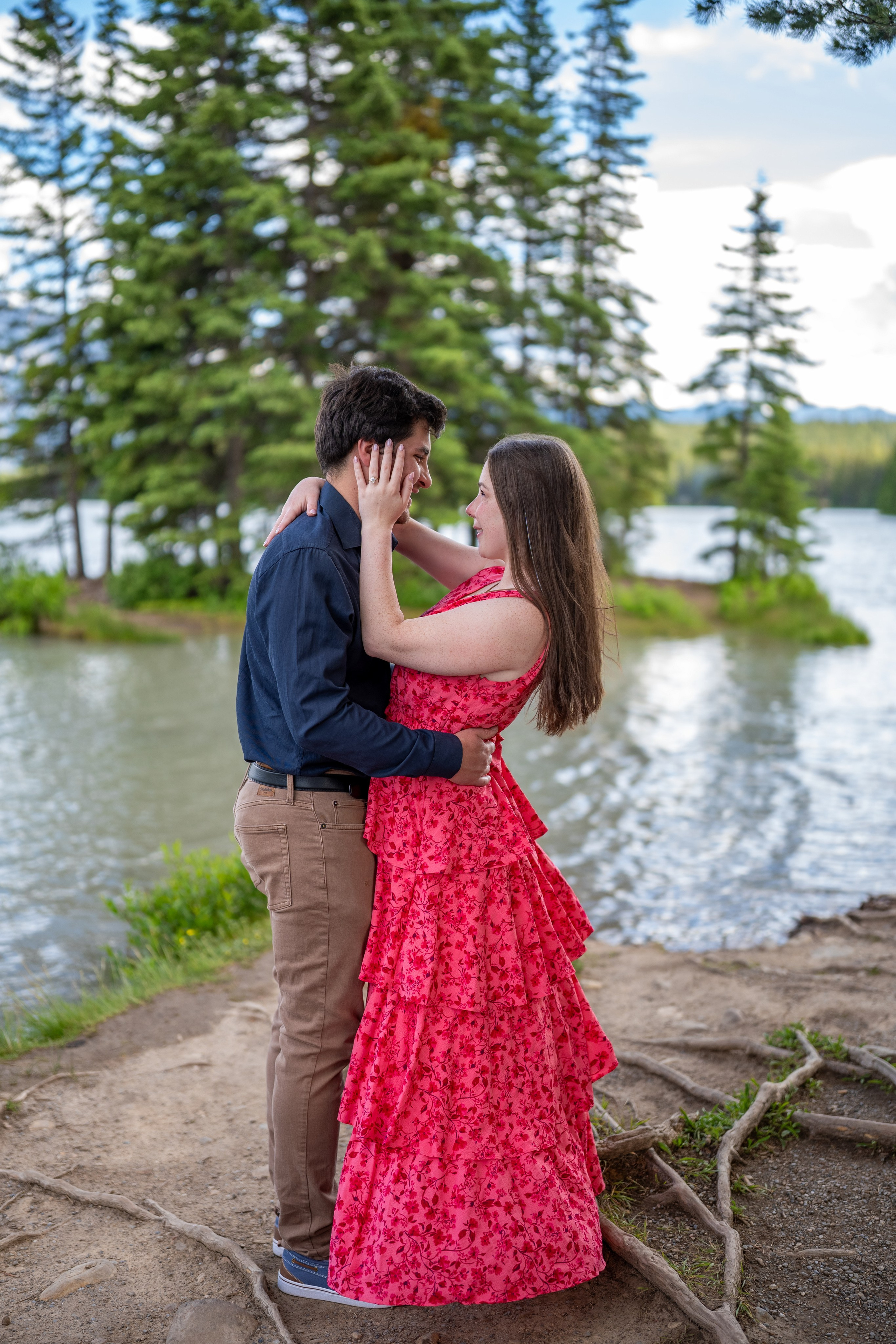 Couple embracing during an engagement photo session in the Canadian Rockies