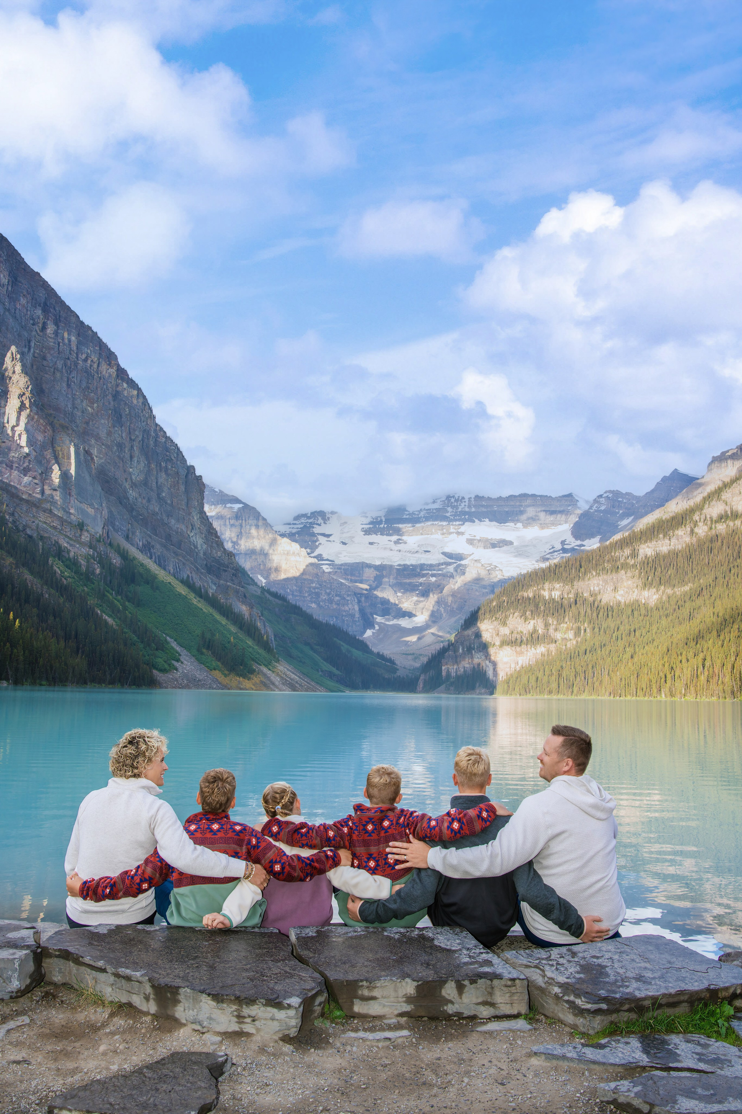 Red canoes on the turquoise water of Lake Louise in Banff, Alberta