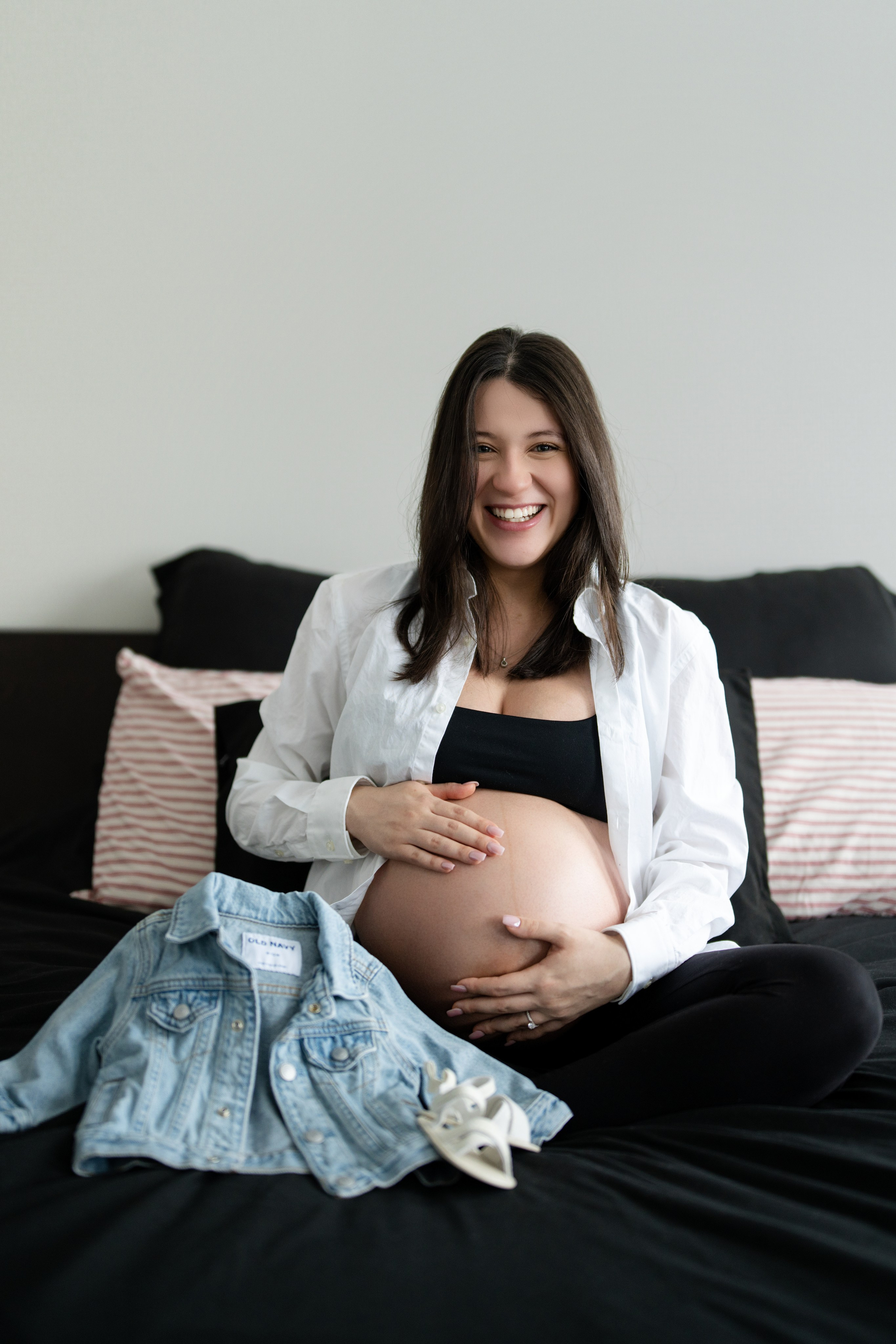 Maternity mini session in Calgary at home with mother-to-be in black