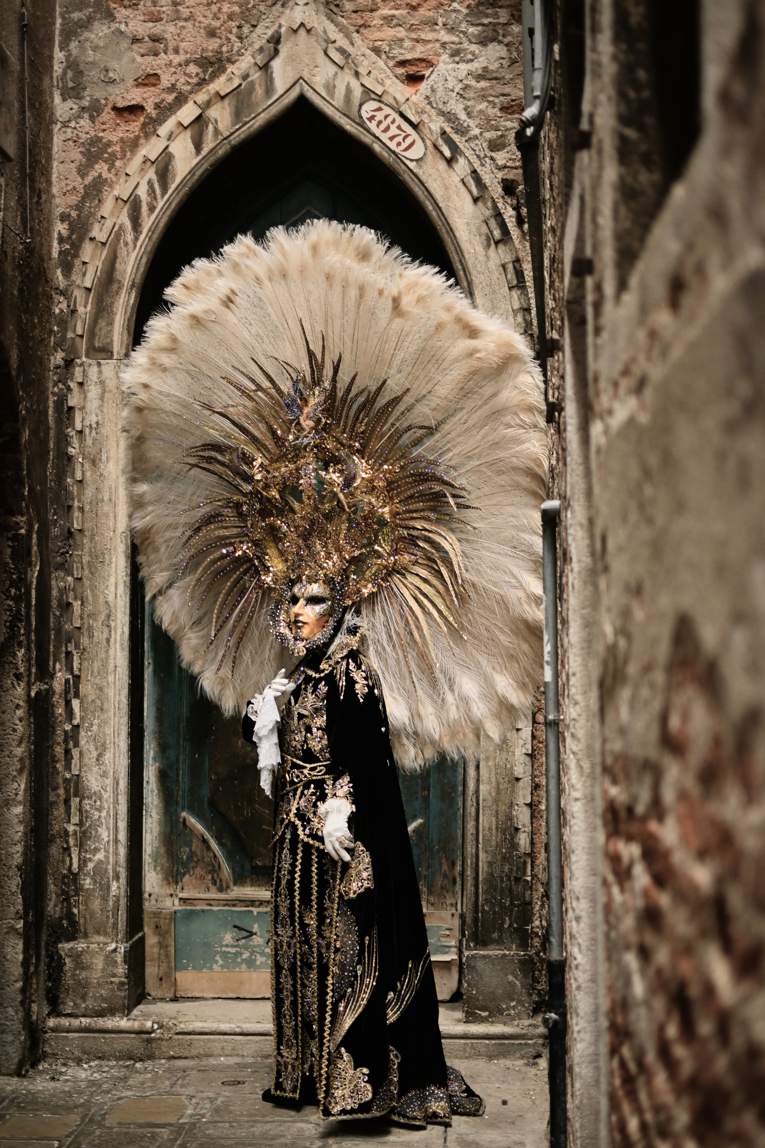 Traditional Venetian masks displayed at the carnival in Venice, narrows streets in Italy, Venetian architecture . The carnival offers endless possibilities for creating unique and artistic photographs, whether it’s capturing the details of a mask or the fluid movement of a costume. I love to play with angles and lighting to bring out the texture and vibrancy of the costumes and masks.