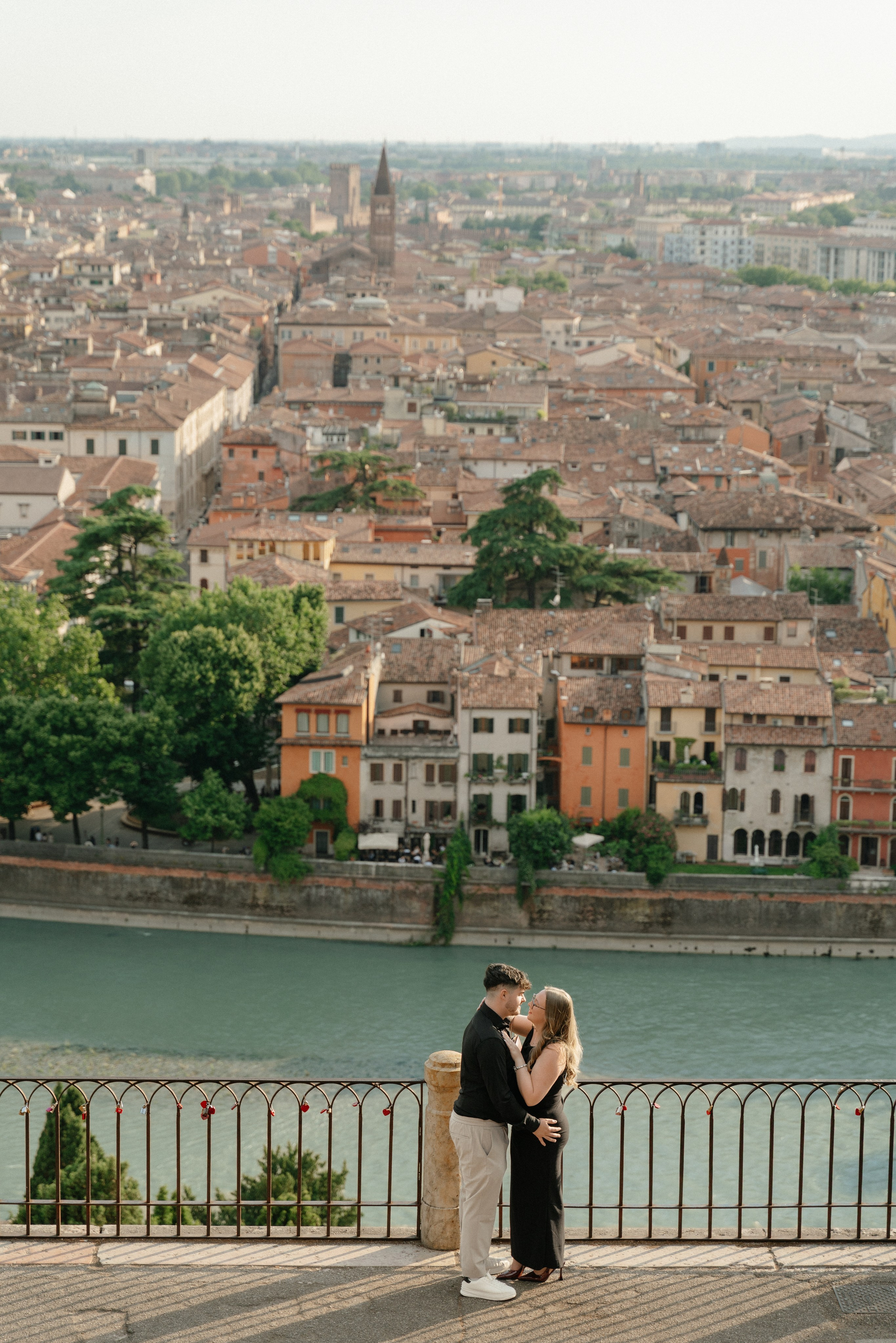 Couple embracing after a sunset marriage proposal in Verona