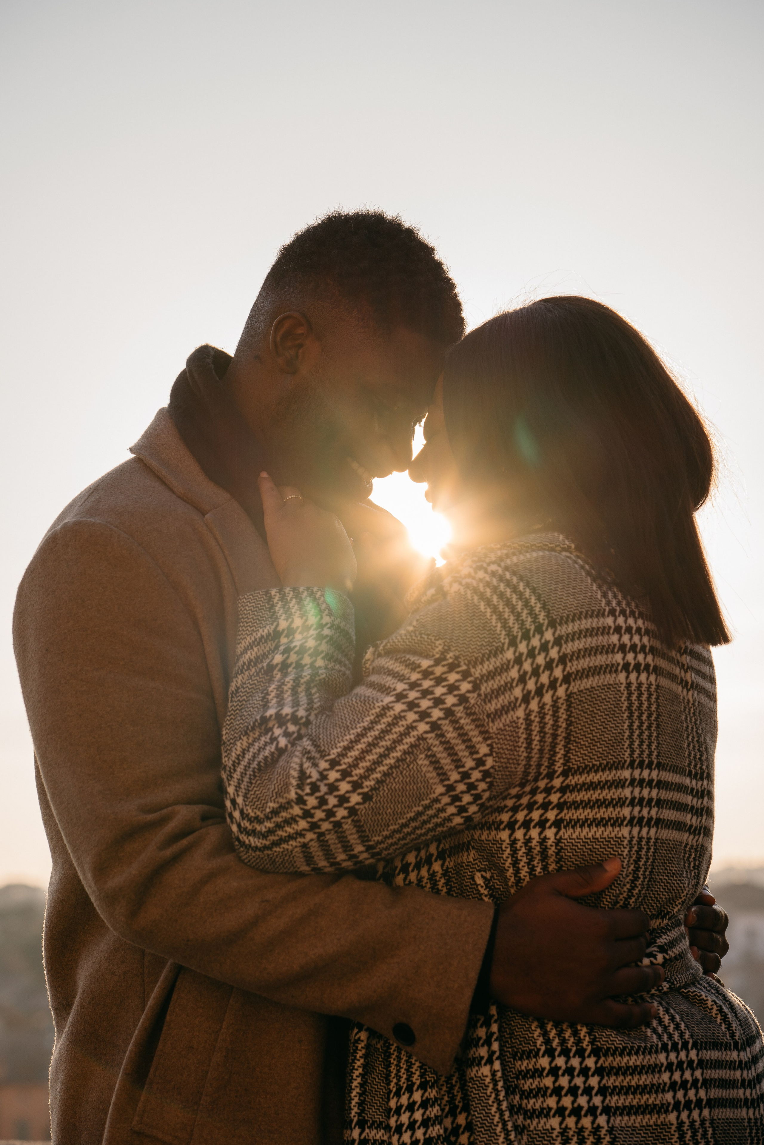 Couple embracing after a sunset marriage proposal in Verona
