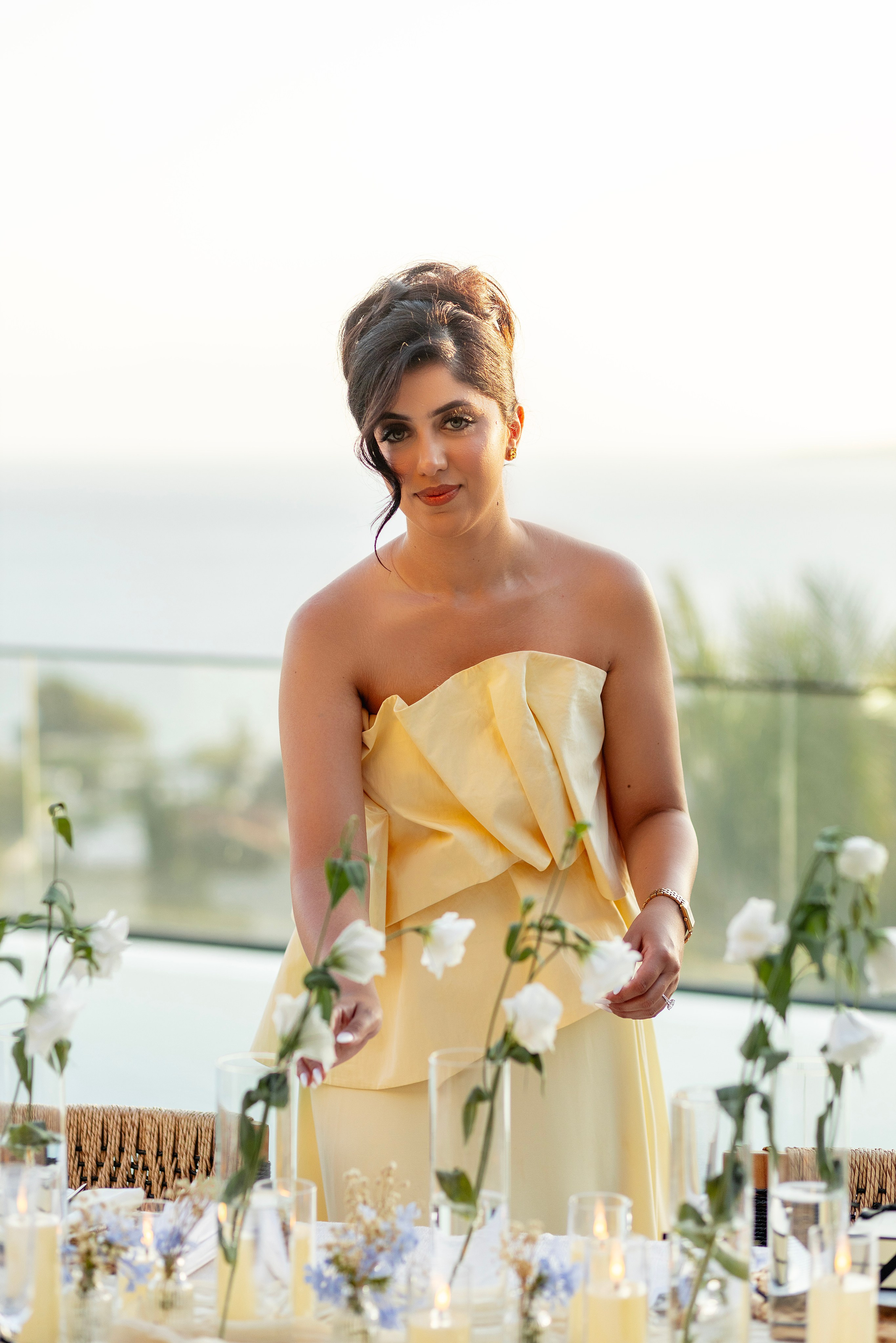 Bride in yellow dress during pre-wedding dinner in Bodrum