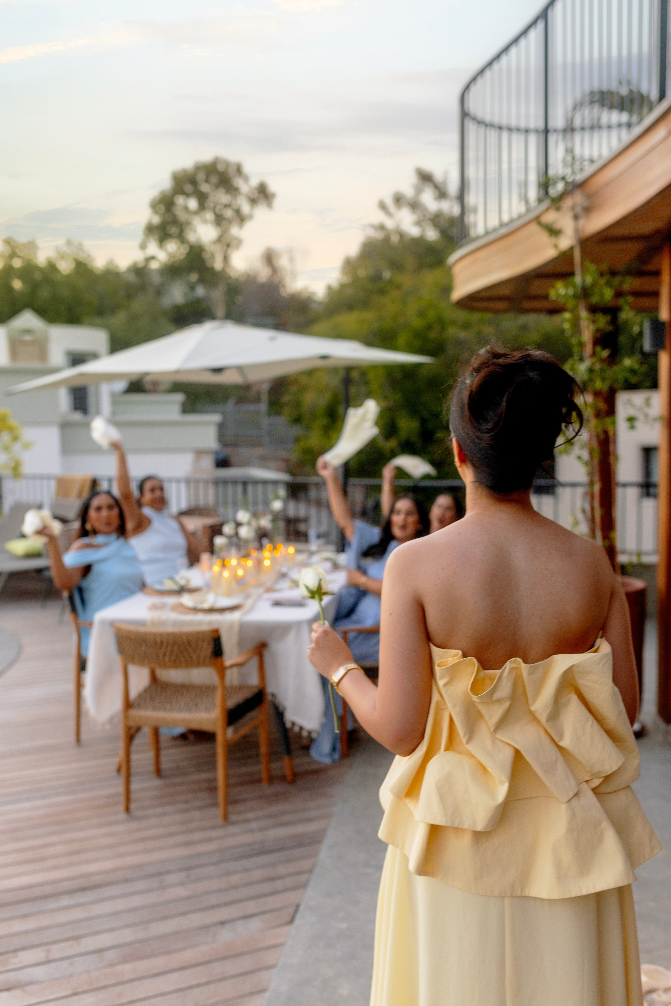 Bride’s friends enjoying the dinner by the pool