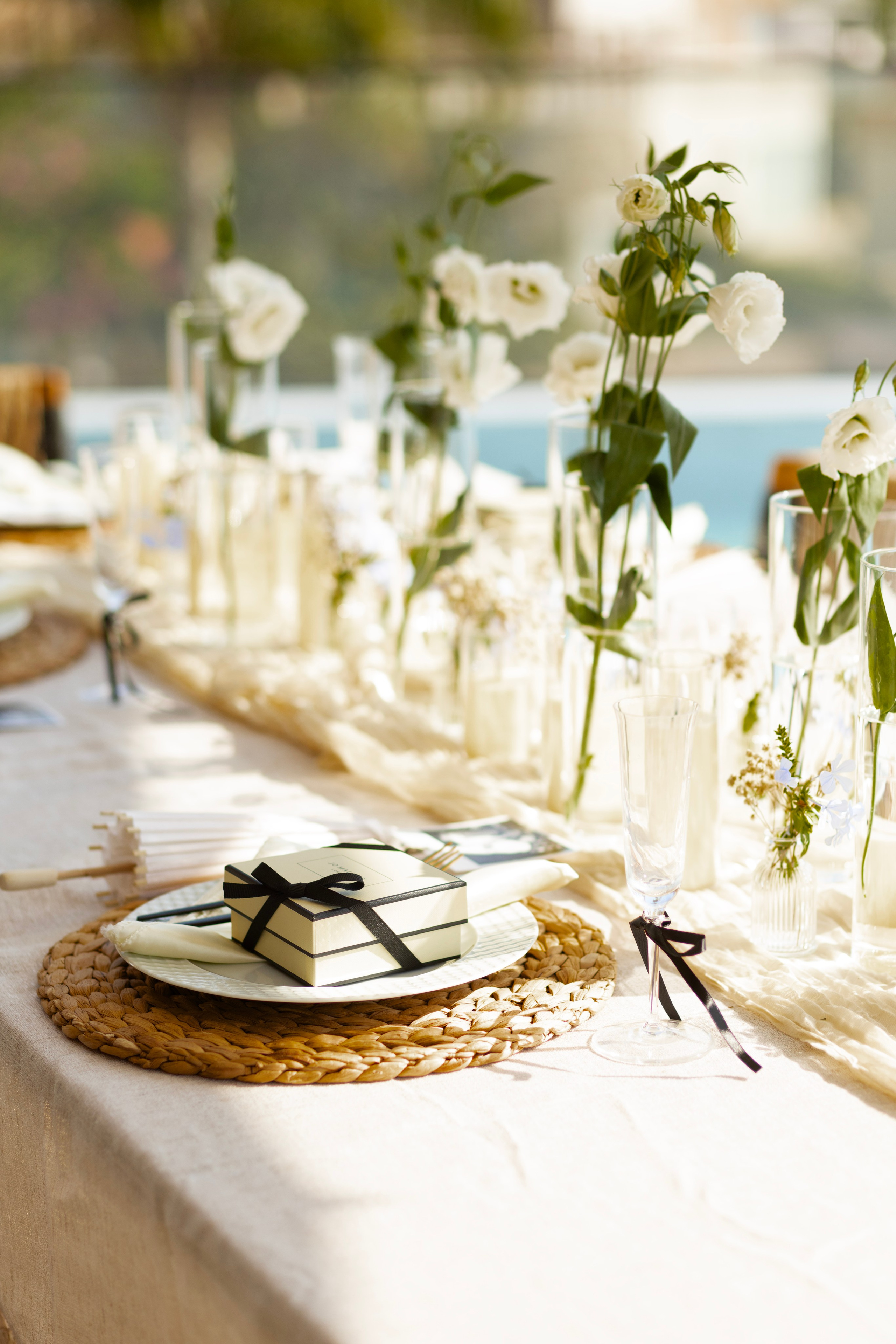 White flowers and candles as wedding decor on private villa table