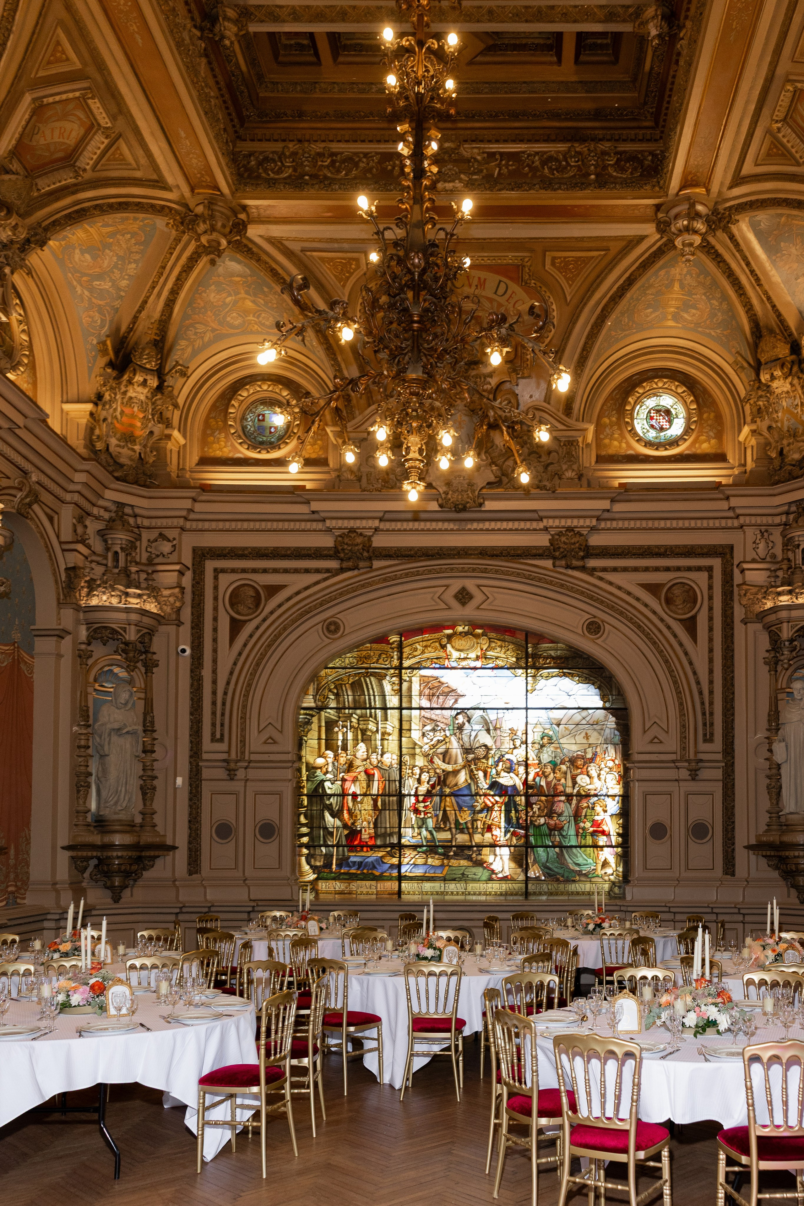 Wedding reception hall with stained glass Palais Bénédictine — luxury destination wedding France