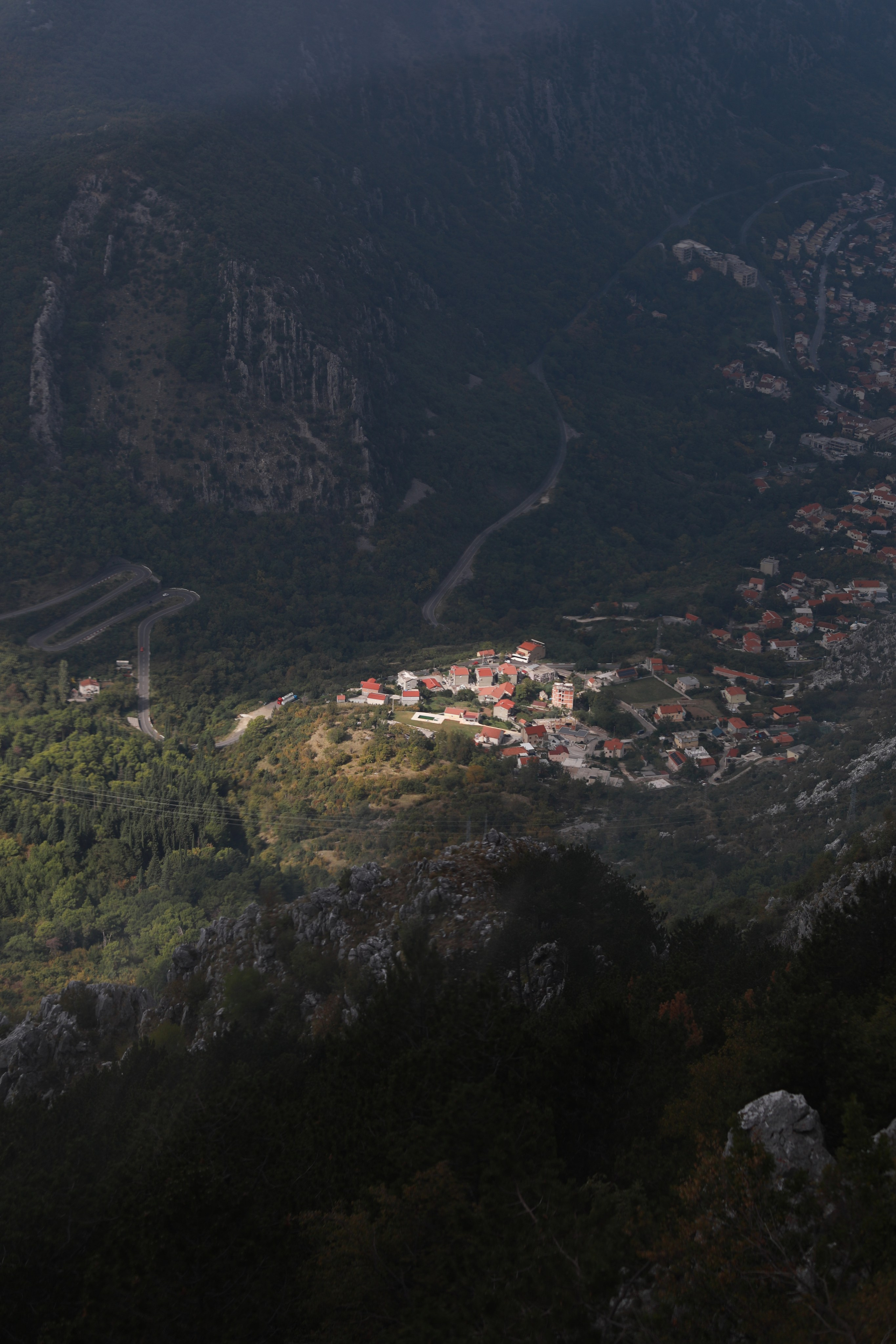 Mountain view over Kotor Bay in Montenegro with village and winding road