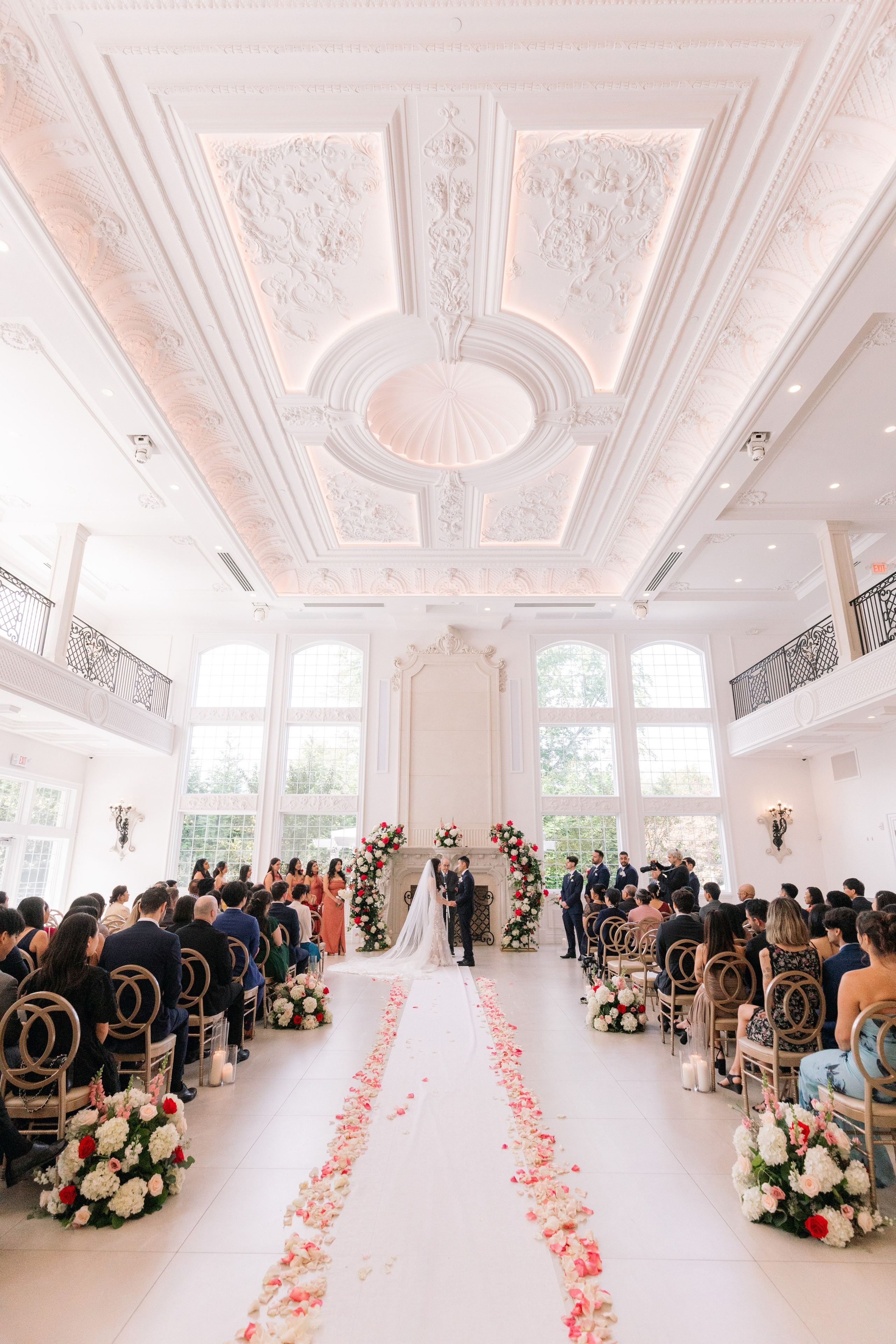 Indoor wedding ceremony in the grand ballroom at The Estate at Florentine Gardens