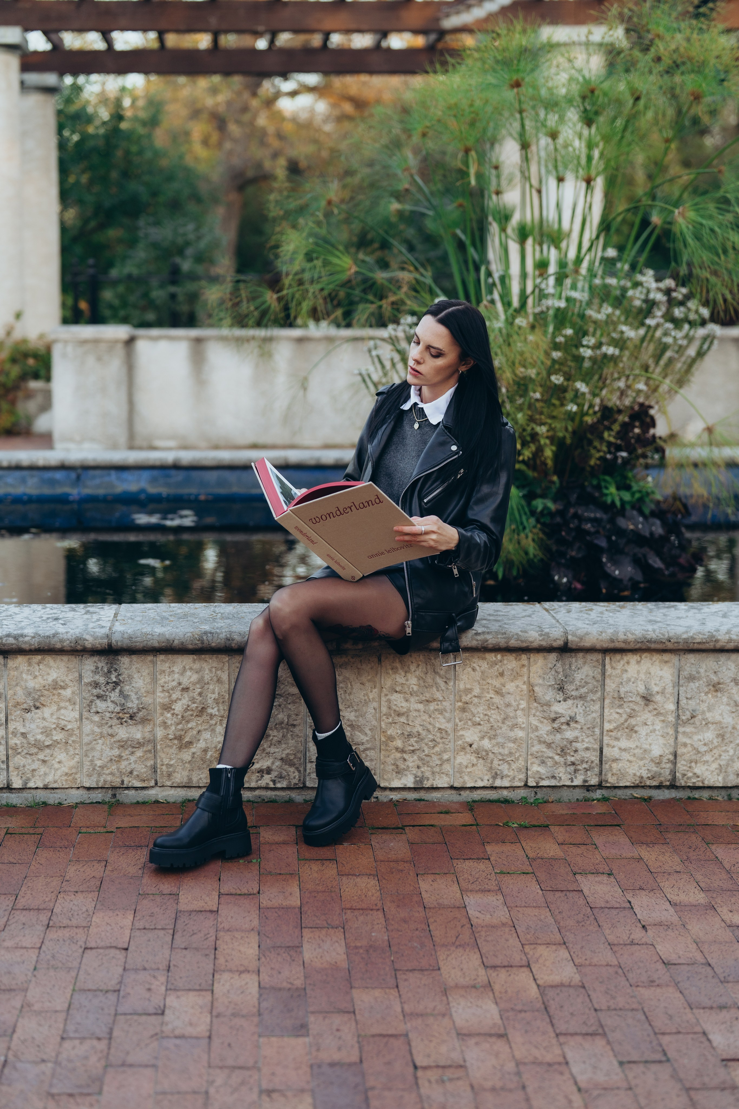 Couple kissing on a rural road during sunset.