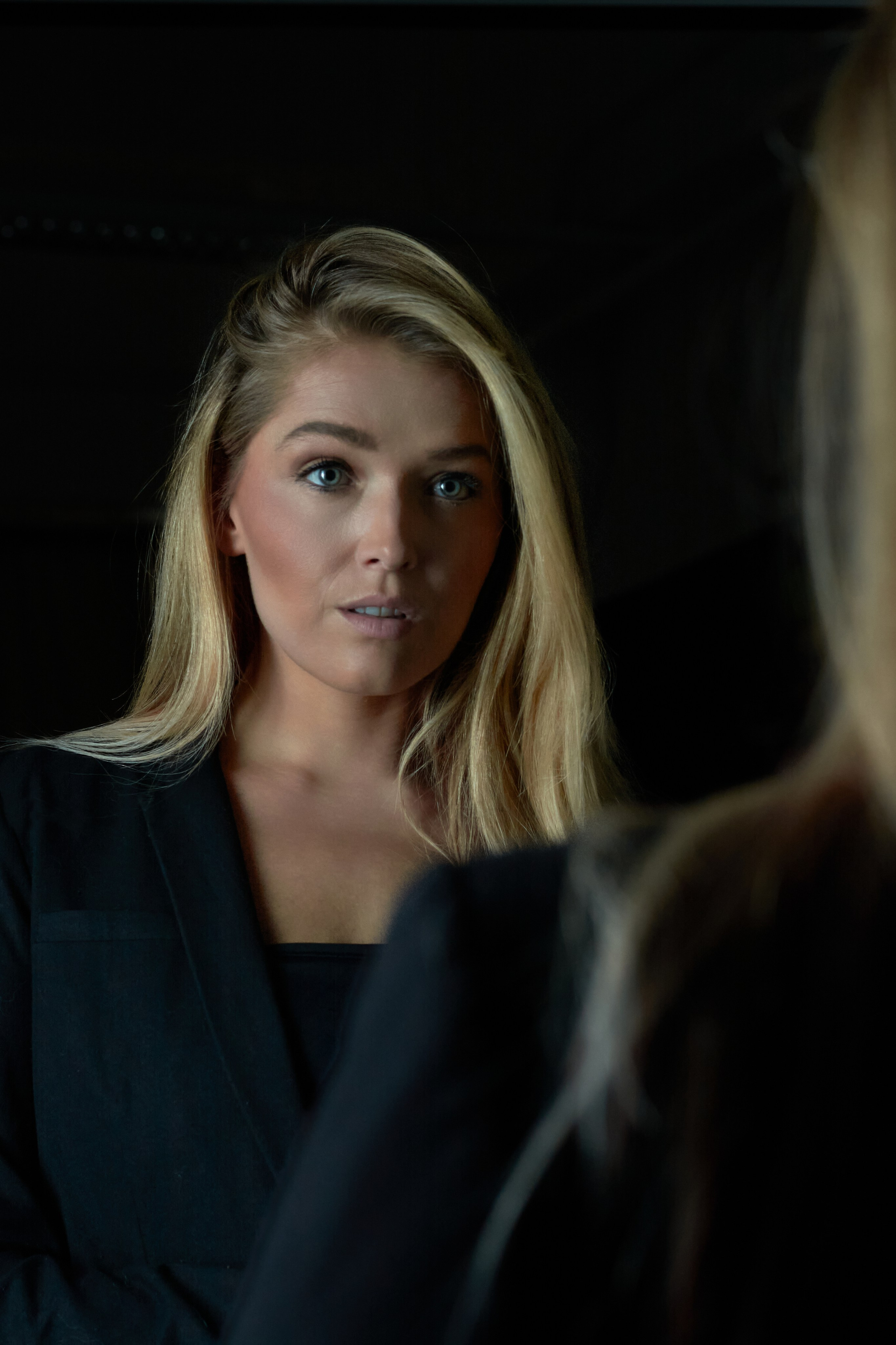 Woman confronting her own gaze