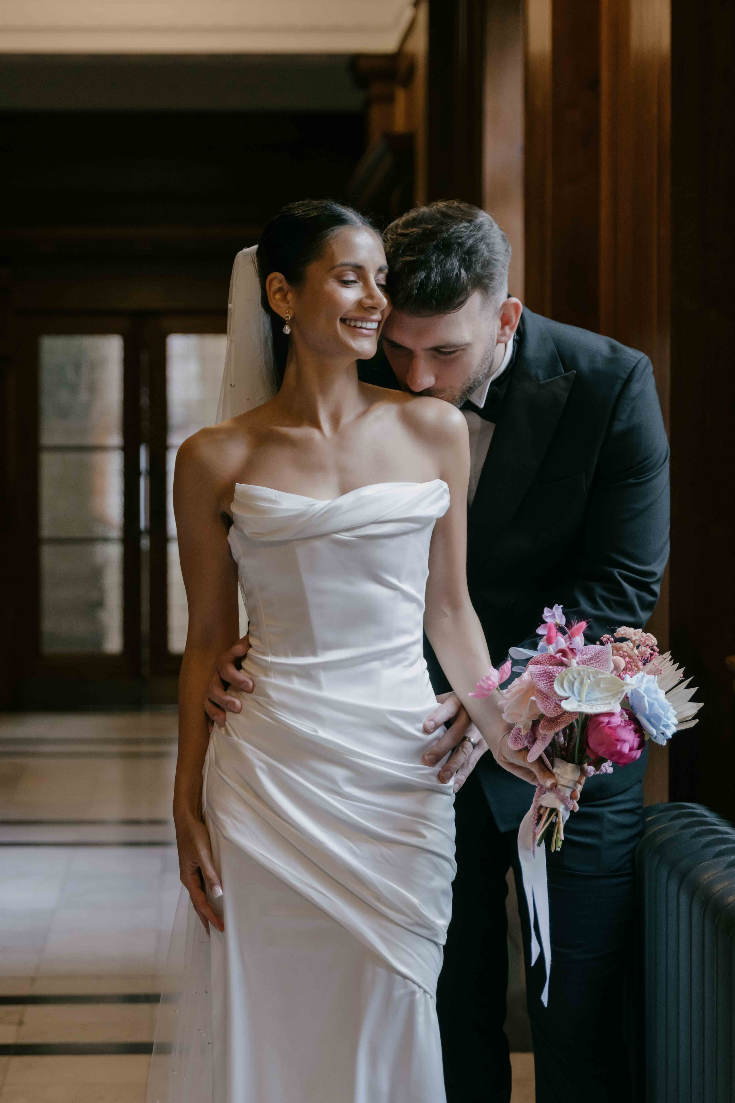 Stylish bride and groom portrait inside elegant wedding venue