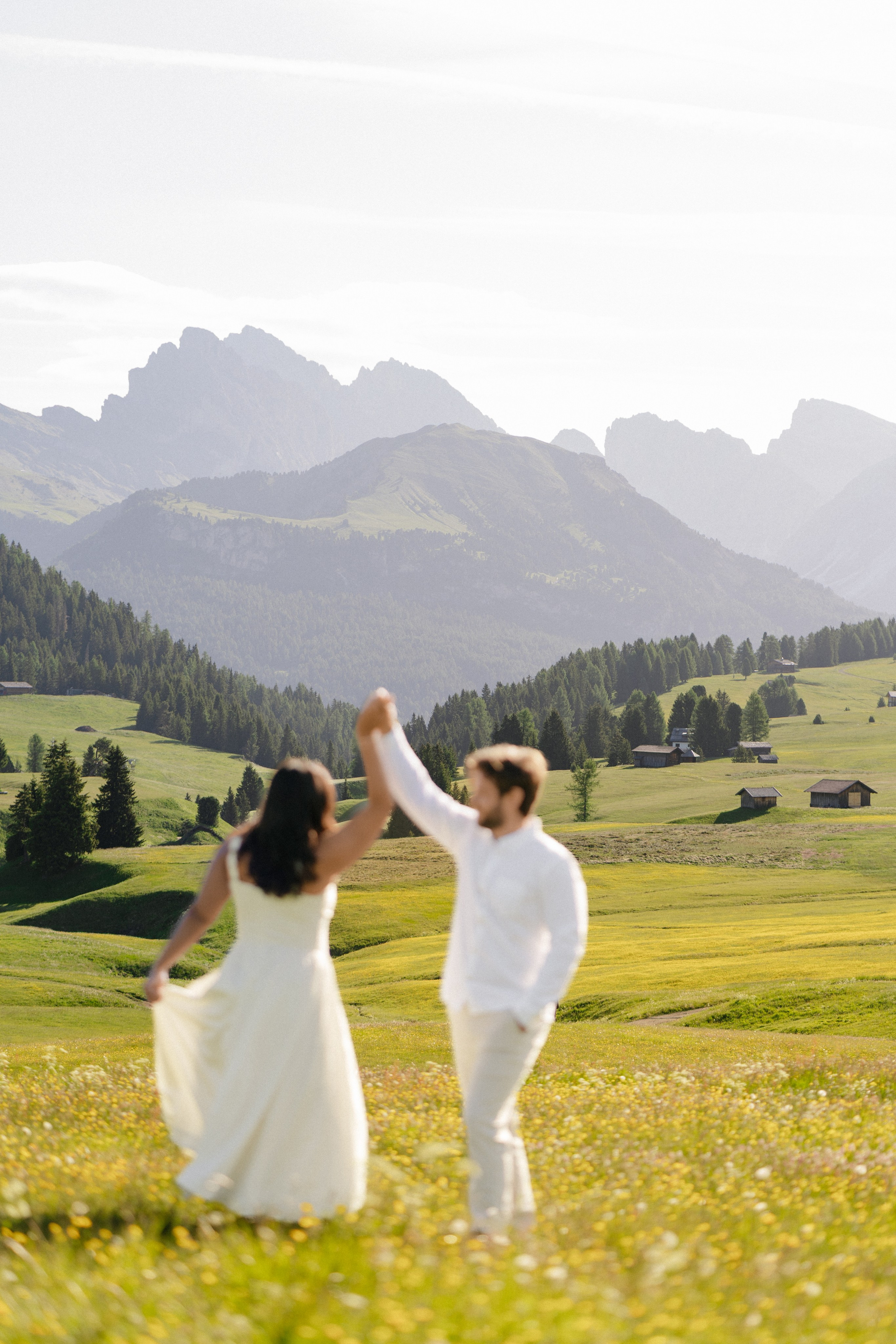 Couple celebrating proposal in Alpi di Siusi in Italy