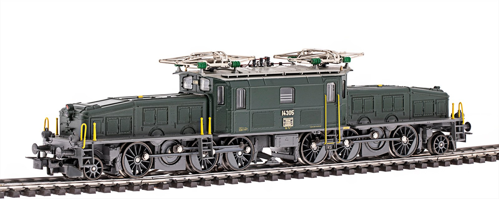 На фотографии крупным планом изображена модель електровоза Märklin 3656, на белом фоне. Фотограф Роман Дюжев.