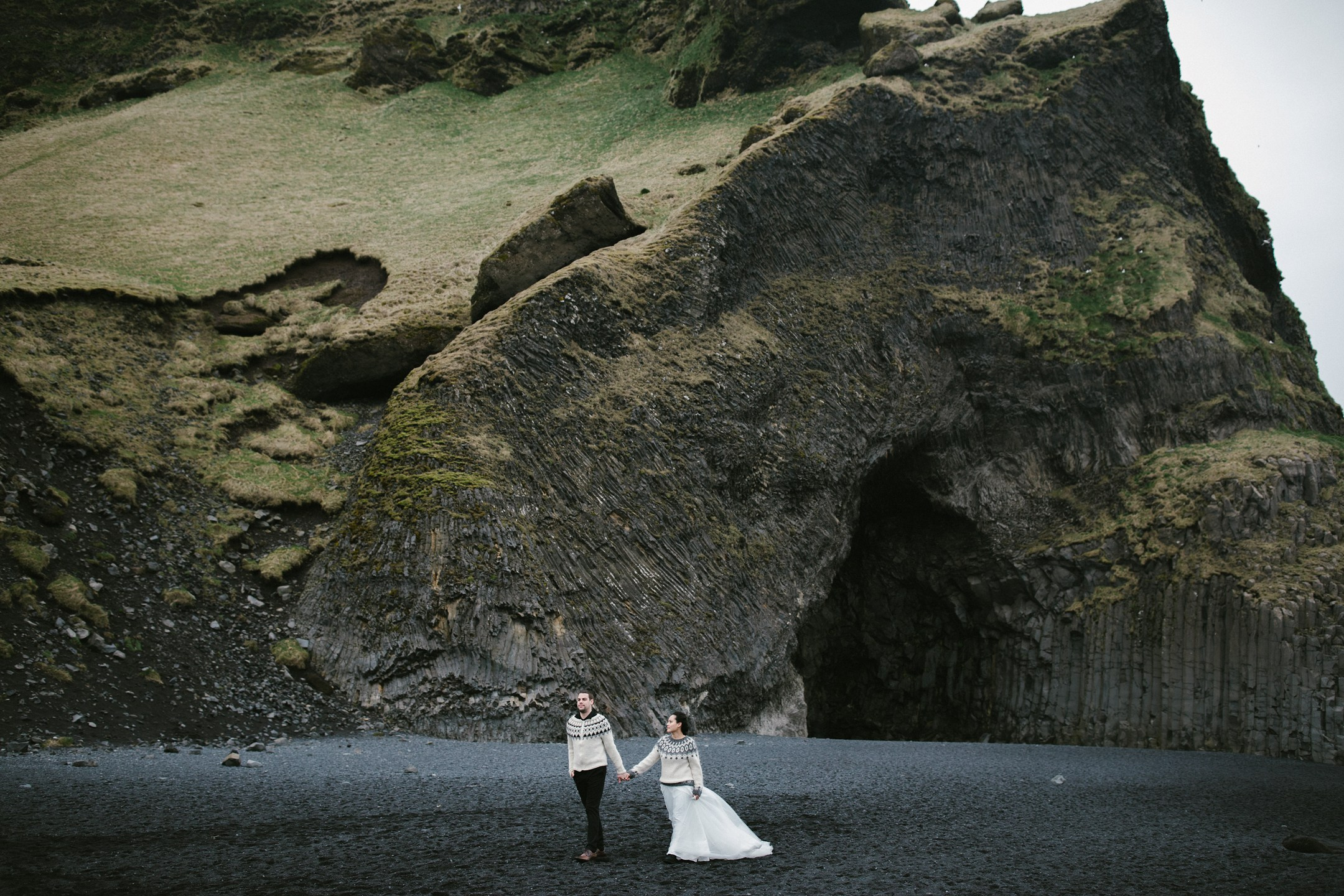 Holding hands at Reynisfjara’s black sand beach, Iceland