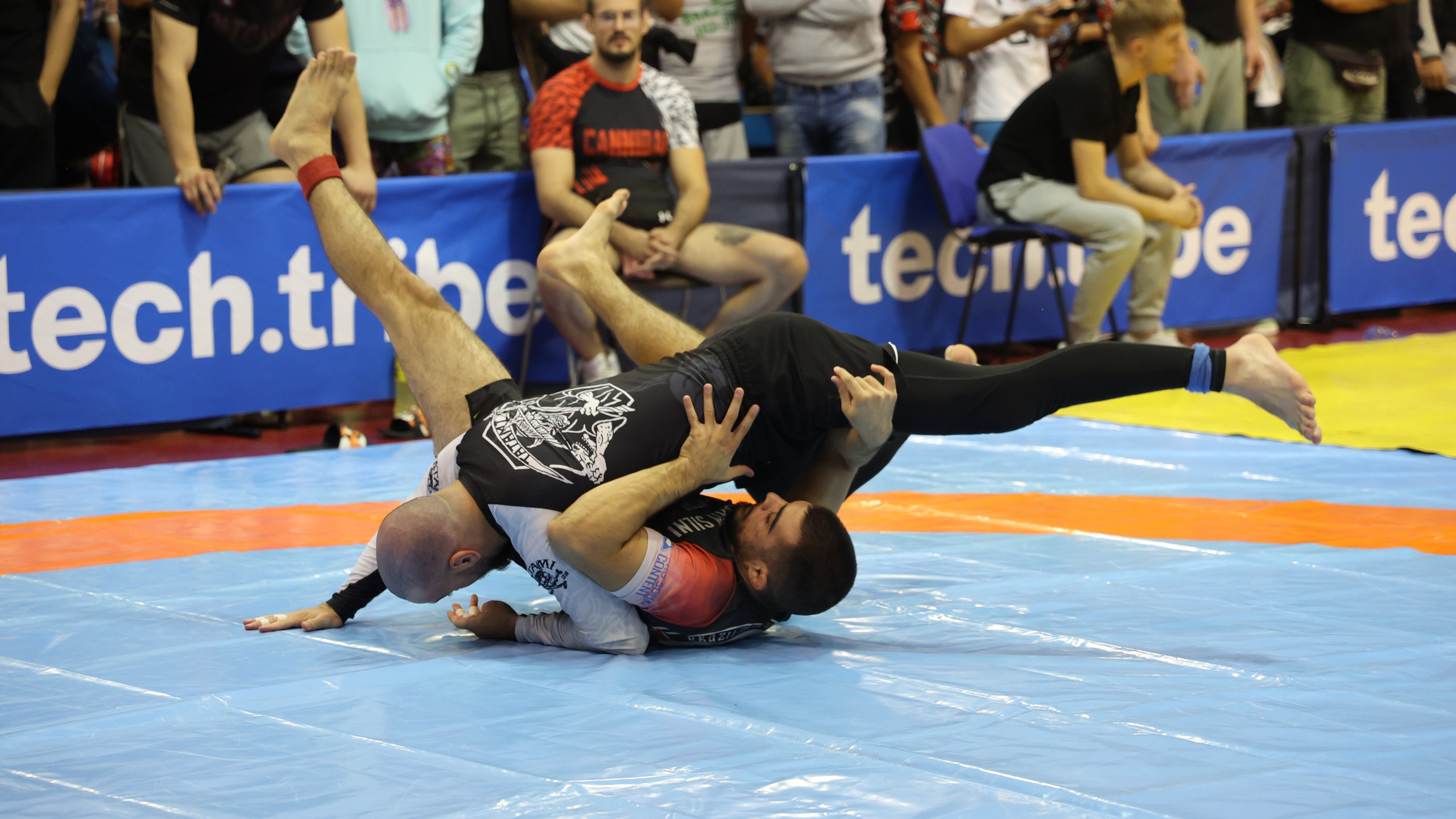 Athletes engaged in a fast-paced scramble during a match