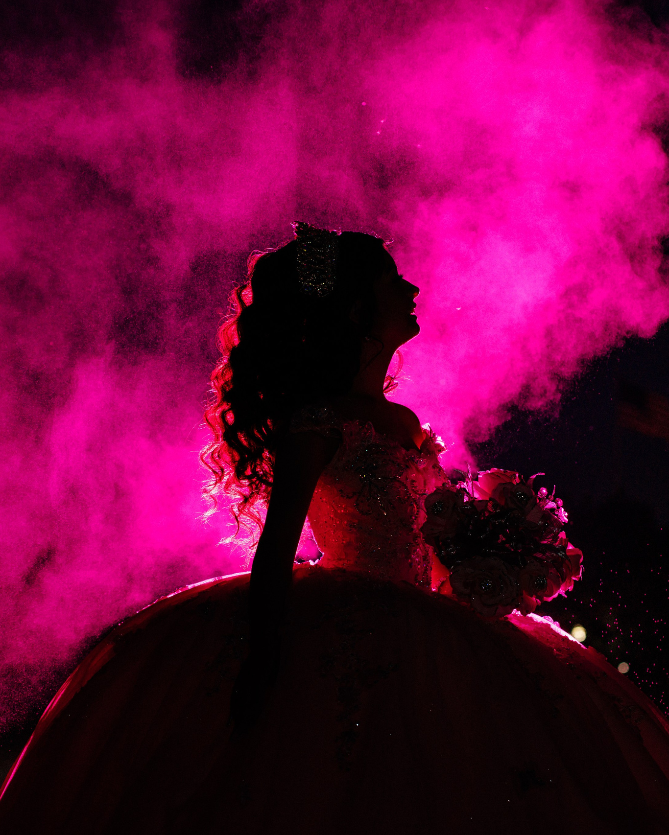 Dramatic silhouette fine art quinceañera portrait with vibrant magenta smoke lighting Indianapolis