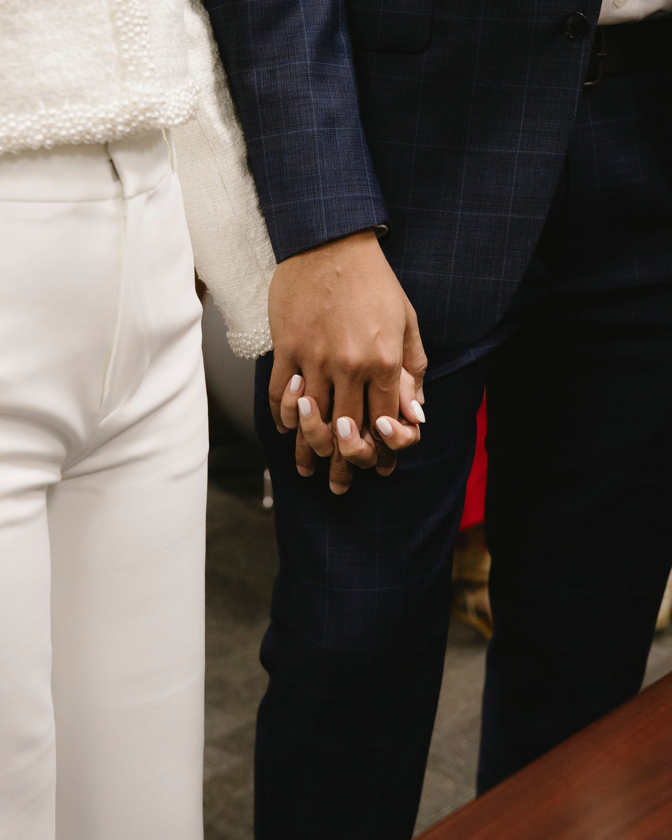 Couple holding hands during their Chicago City Hall wedding ceremony.