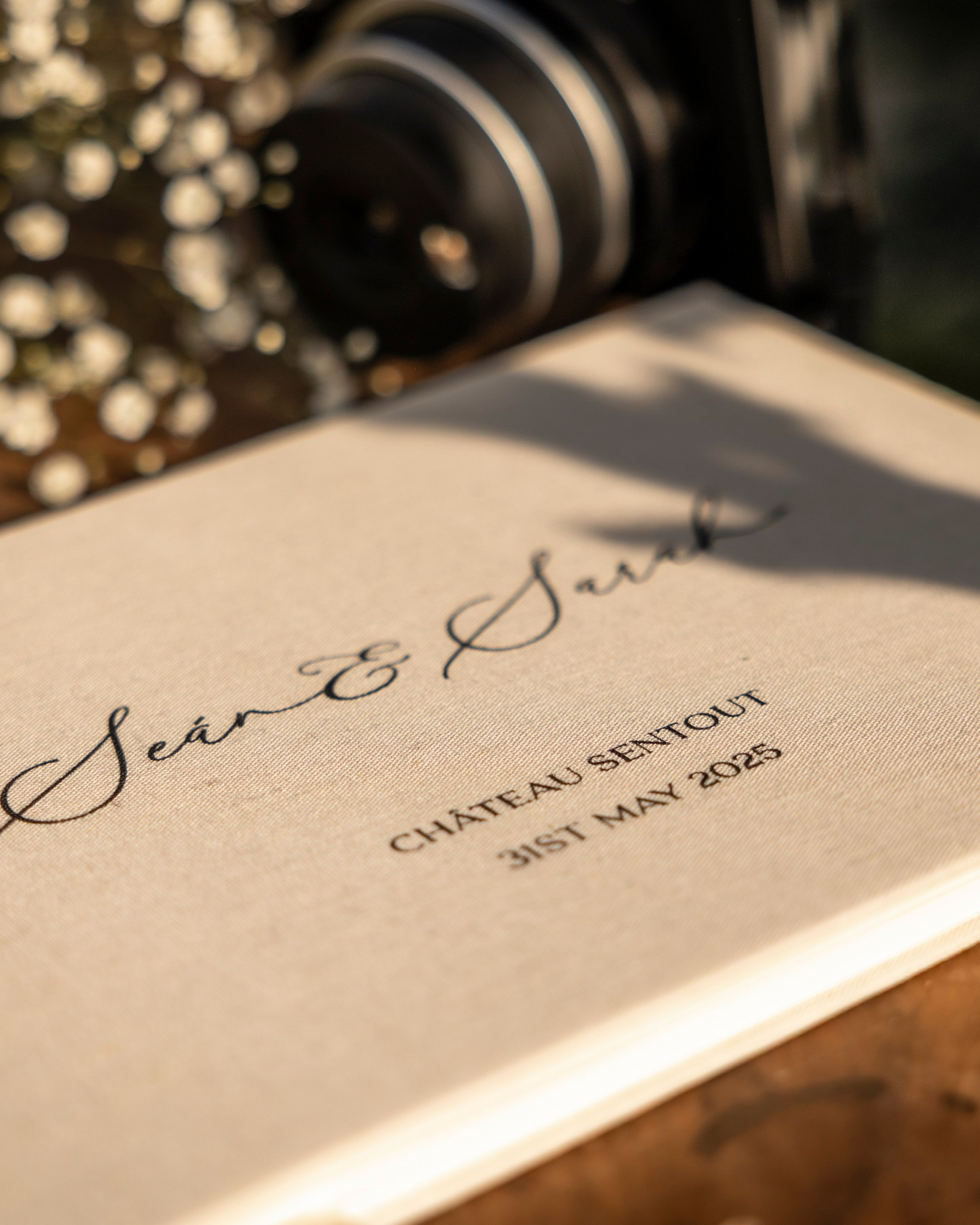 close-up detail of a wedding album or printed photo book on a table in natural light
