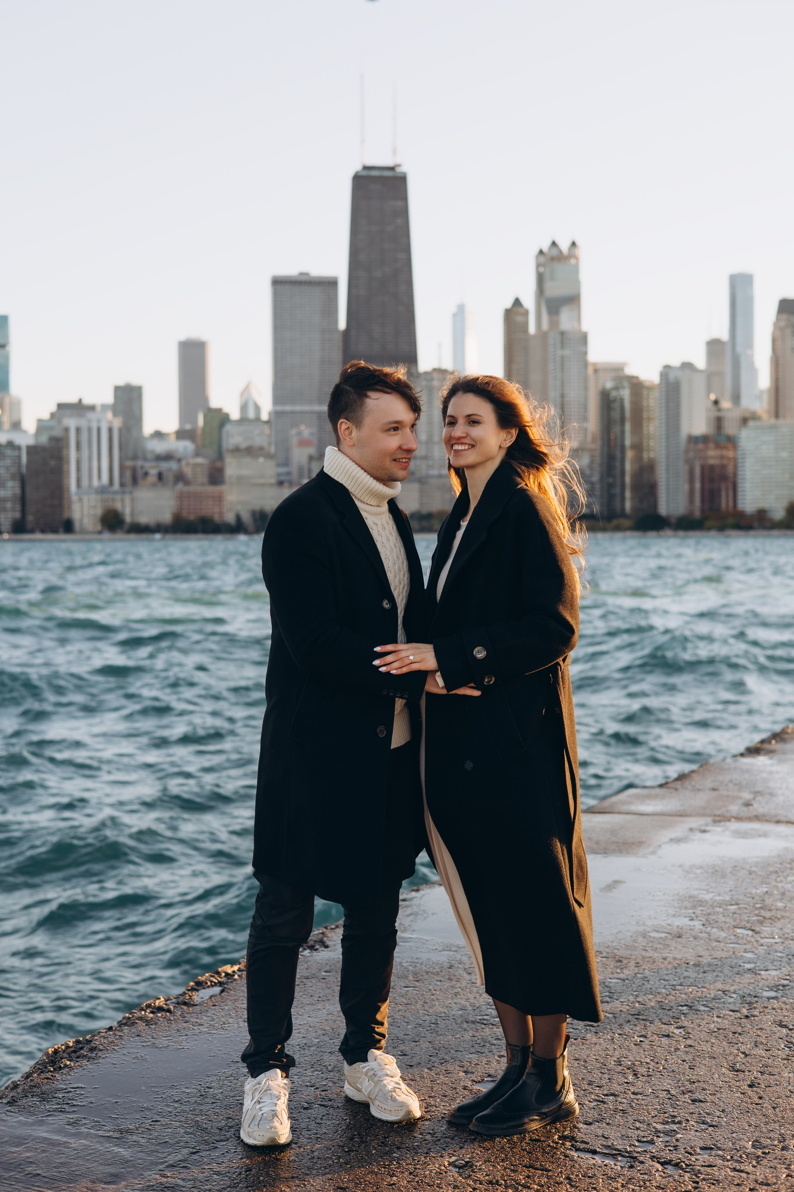 Bold Chicago skyline engagement portraits at North Avenue Beach Pier.