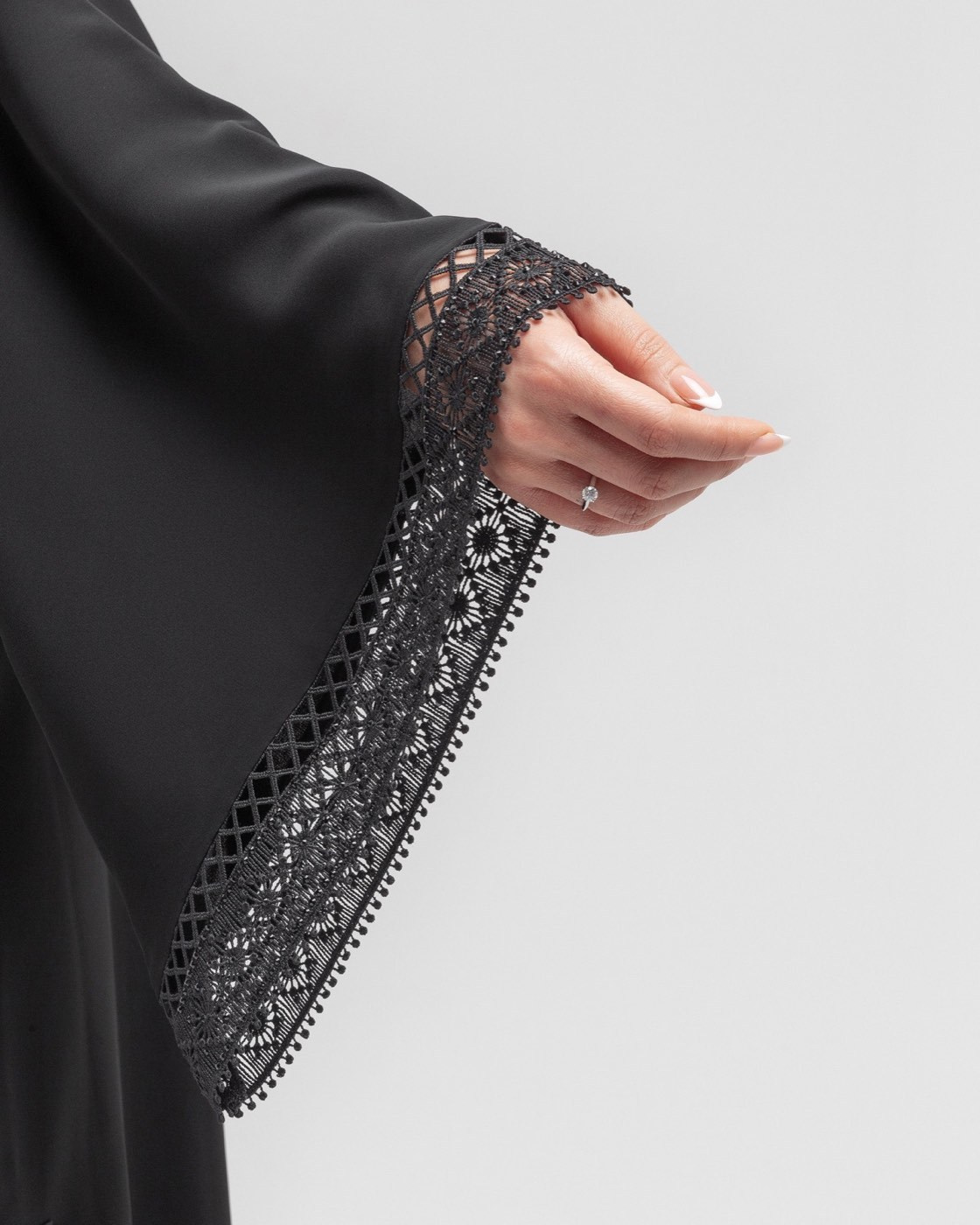 Close-up of embellished fabric showing details that must be prepared before clothing photography