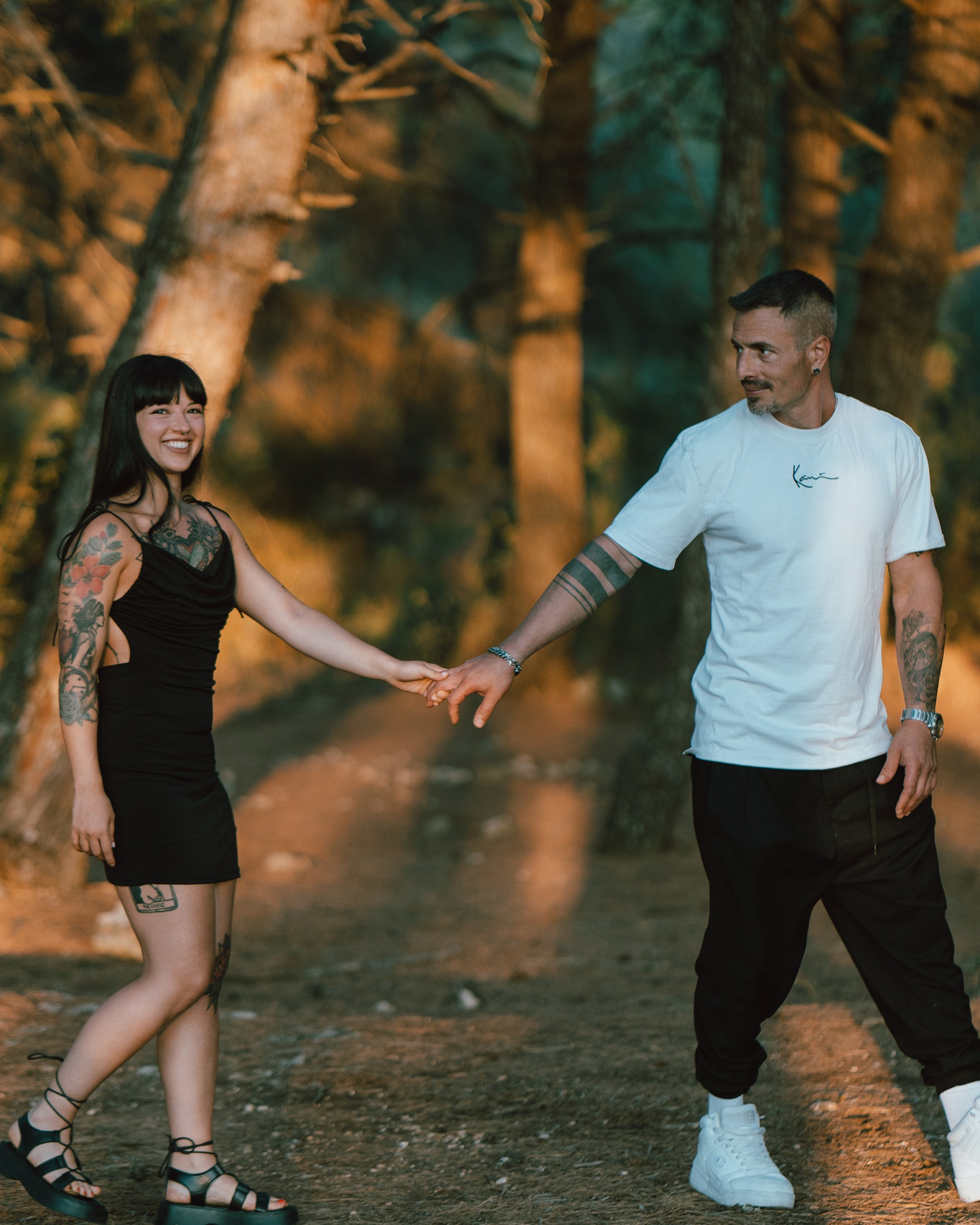 Couple walking hand in hand during surprise proposal planning session at Garda Lake, romantic engagement photography