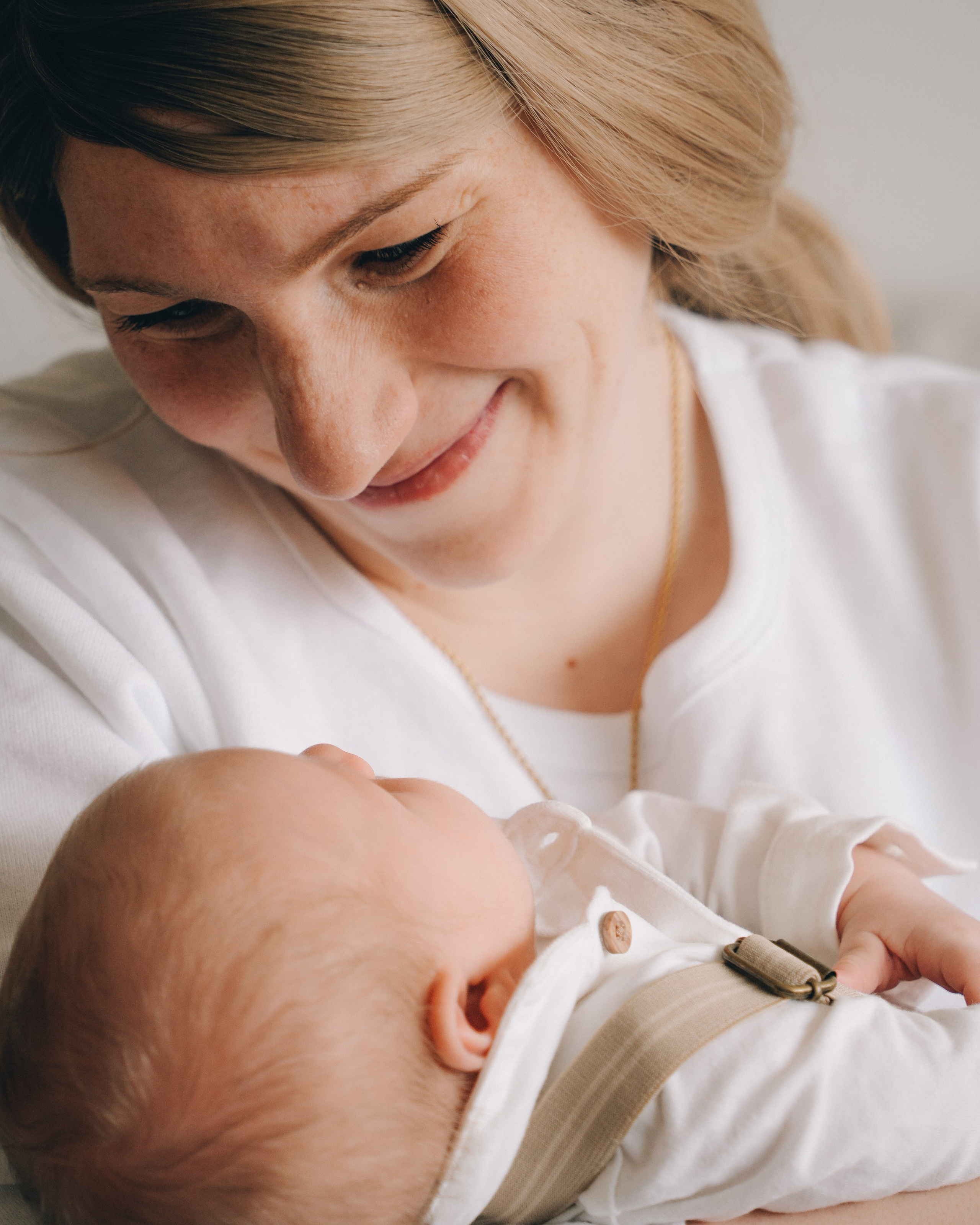 Mother holding newborn baby natural newborn photography Solihull