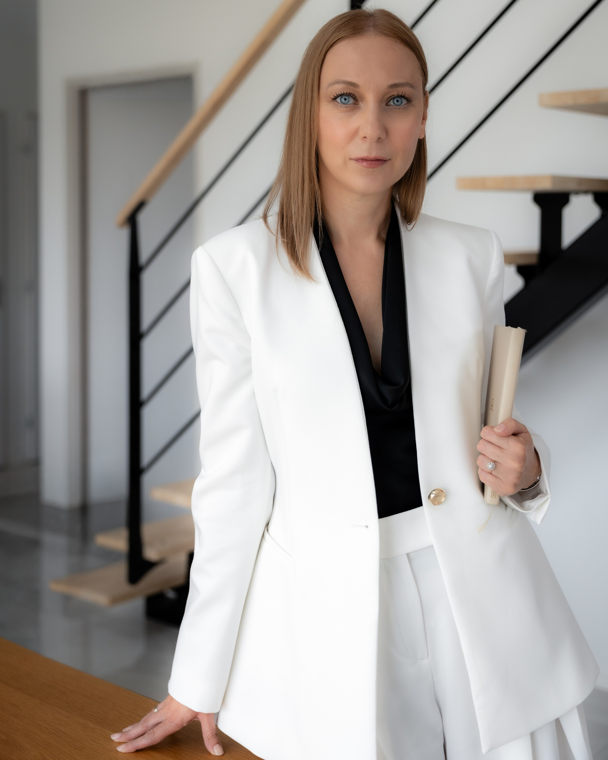 Professional woman in a white blazer, editorial personal brand portrait in Toulouse