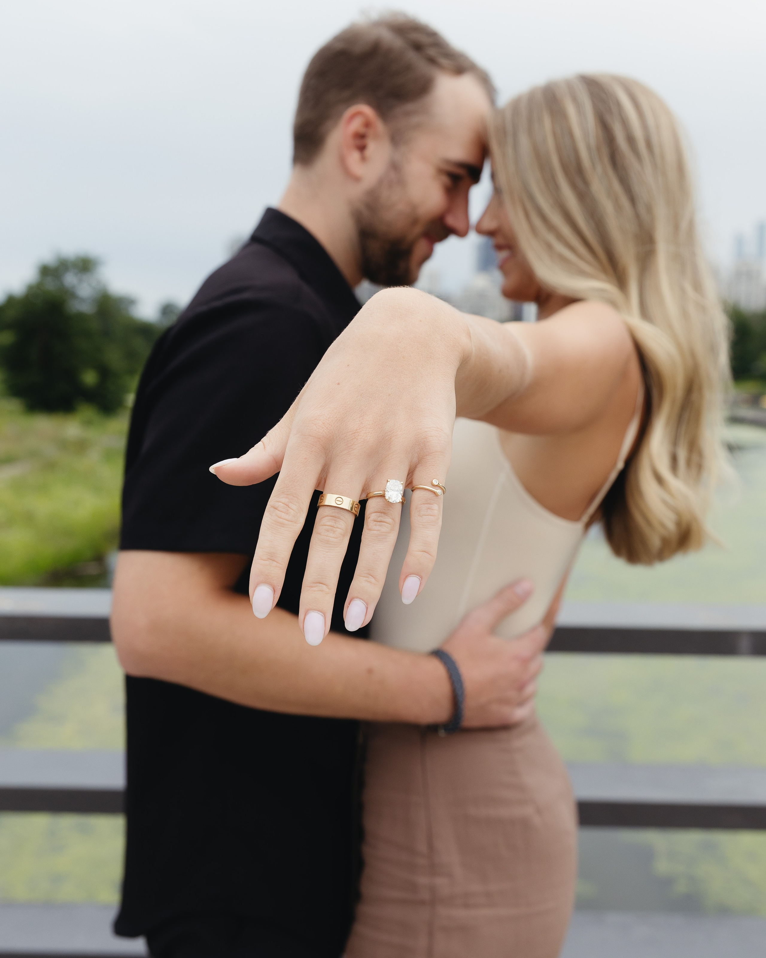 Close-up of a couple’s hands with an engagement ring after a proposal in Chicago