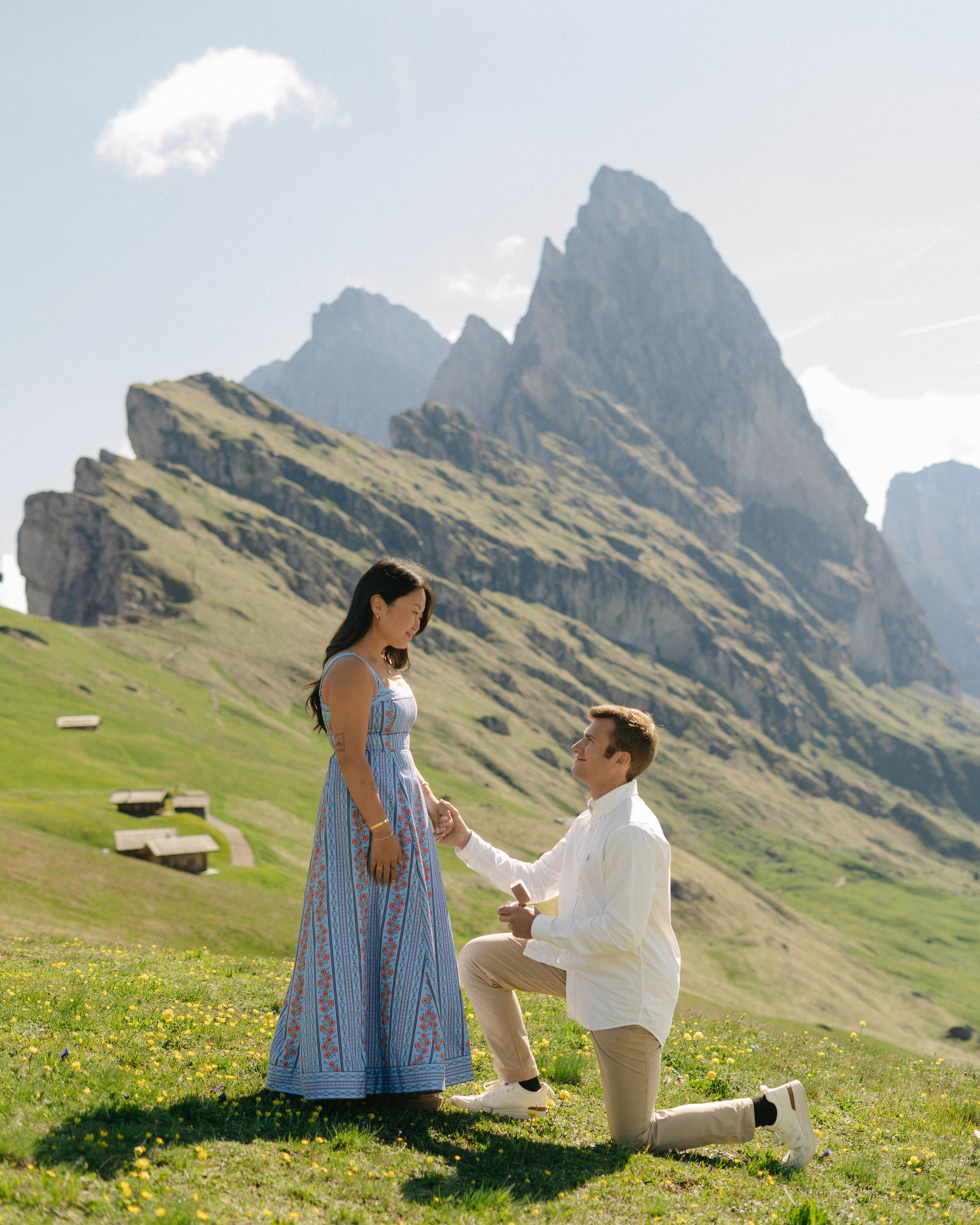 Marriage proposal on Seceda Mountain, in Dolomites, with Seceda ridge on the background