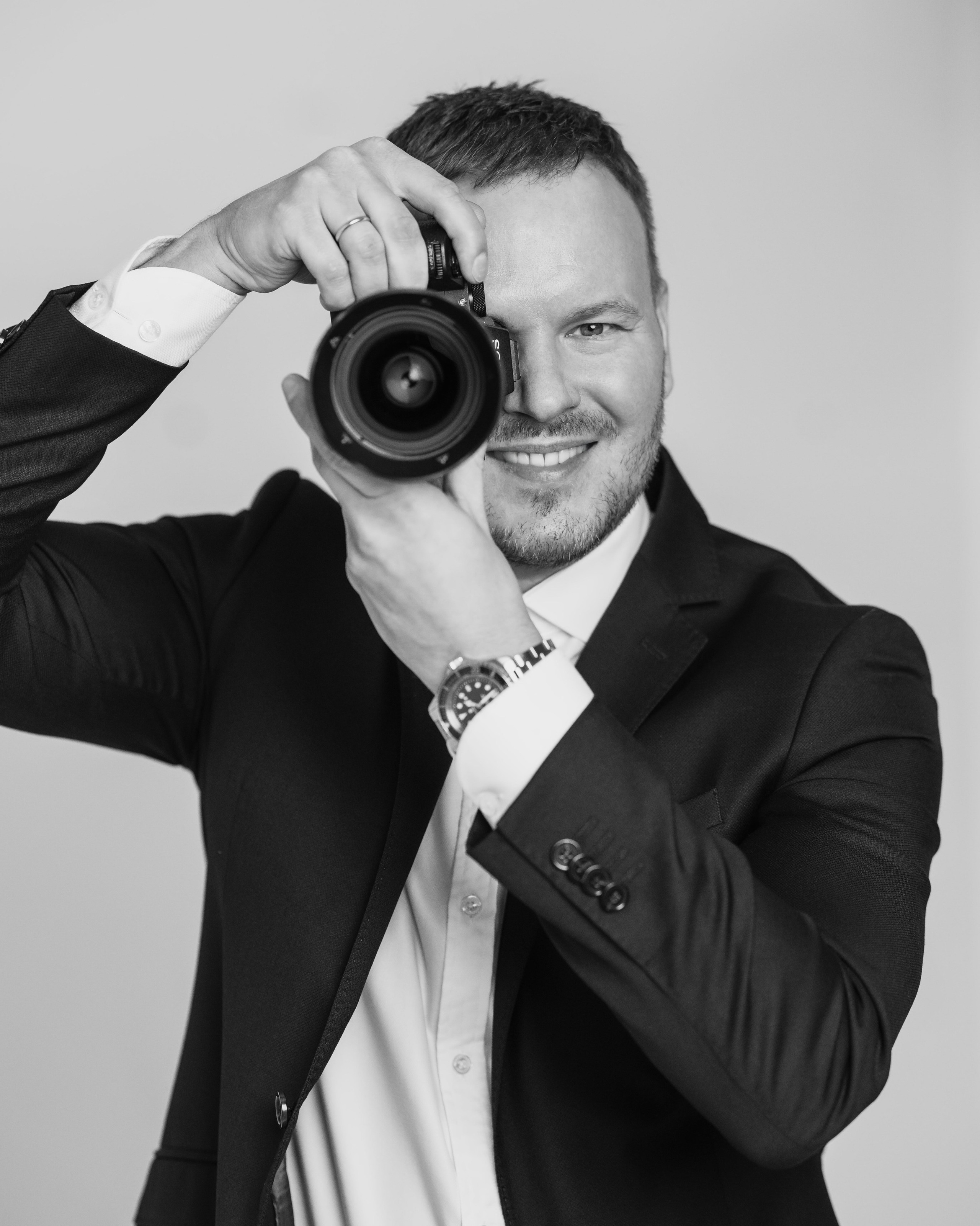 Oleg, destination wedding videographer and founder of Wed Tides, filming a wedding in Europe