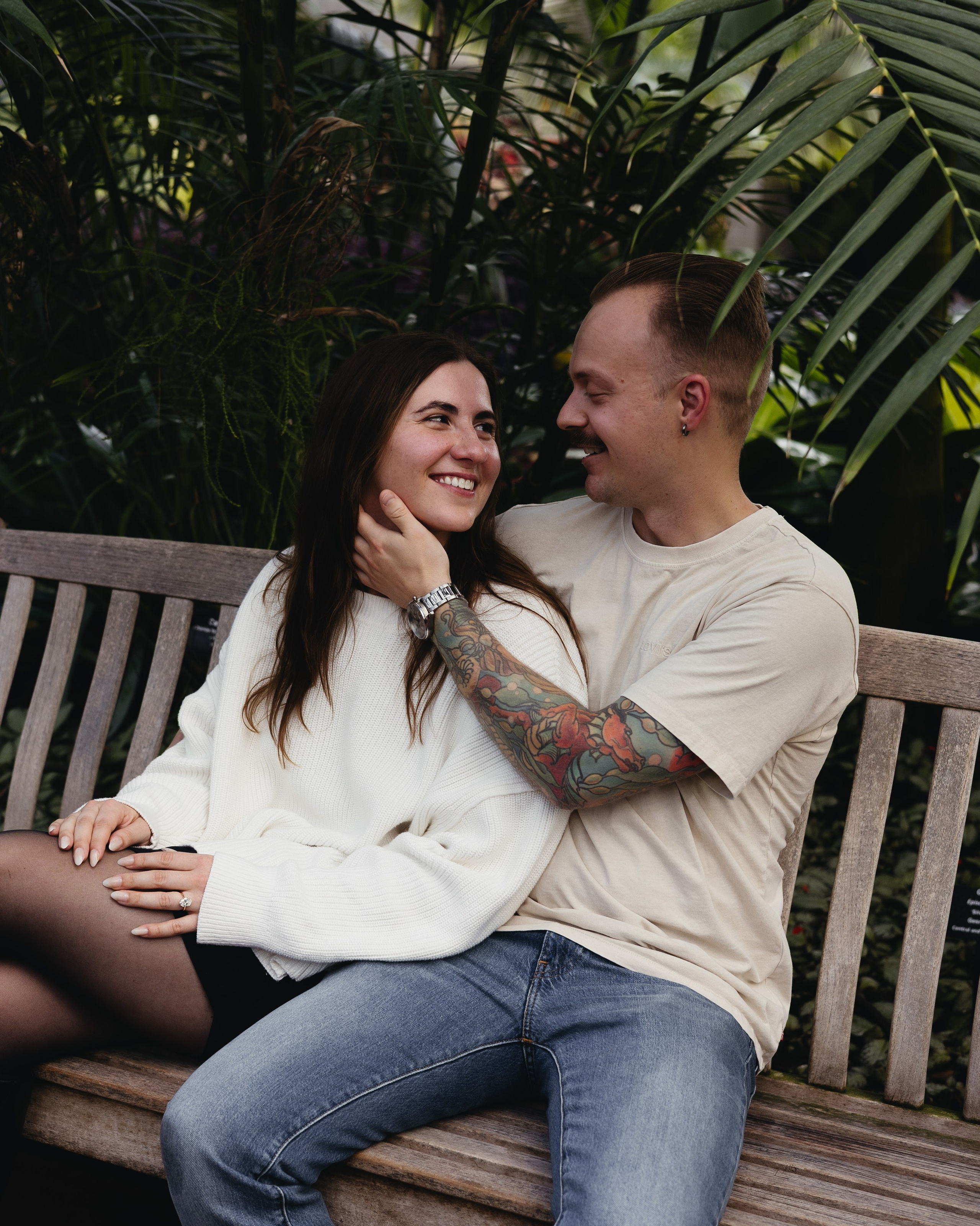 Couple laughing inside Palm Room at Garfield Park Conservatory