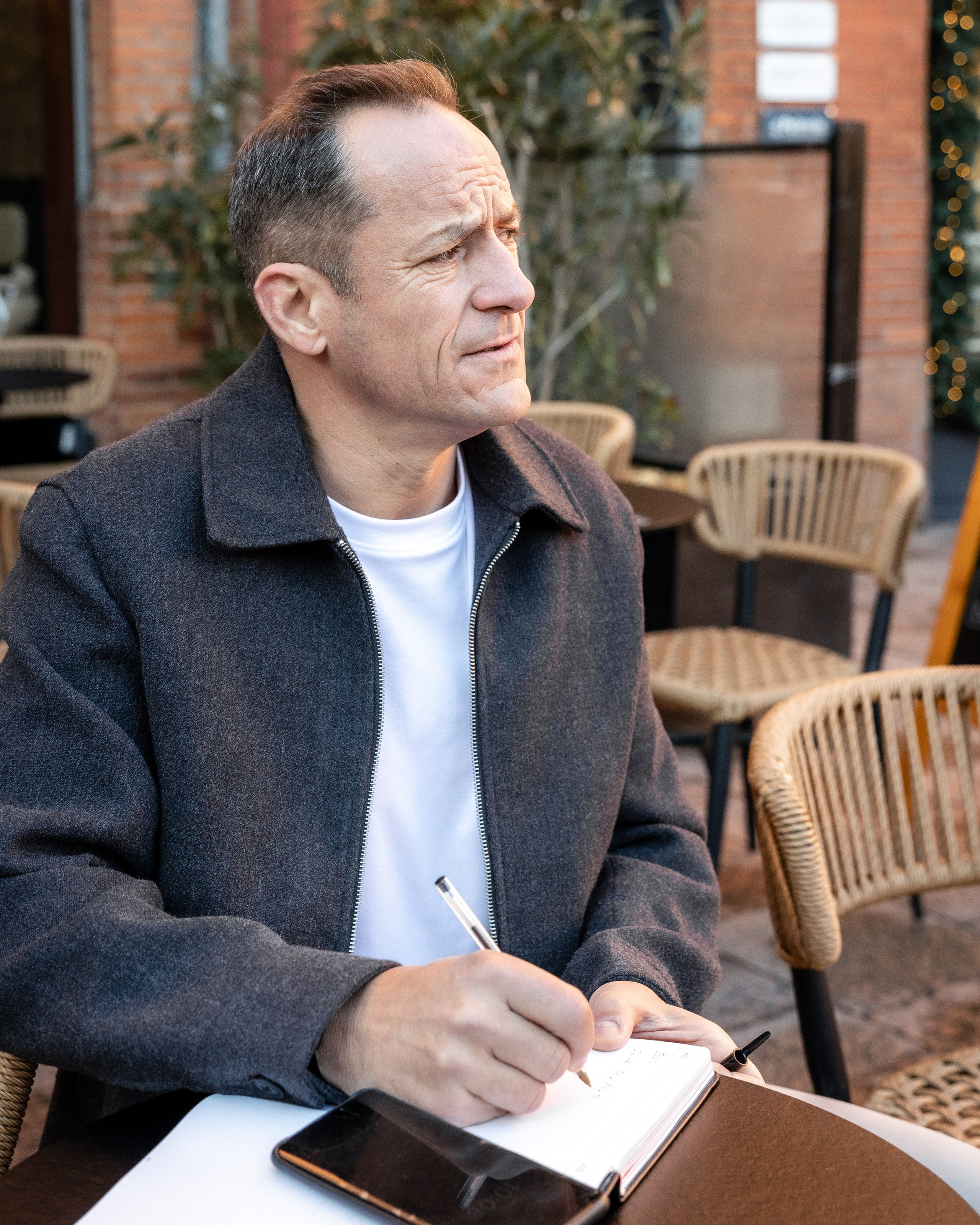 Executive portrait of company founder at Place Saint-Étienne during a corporate personal branding photoshoot.