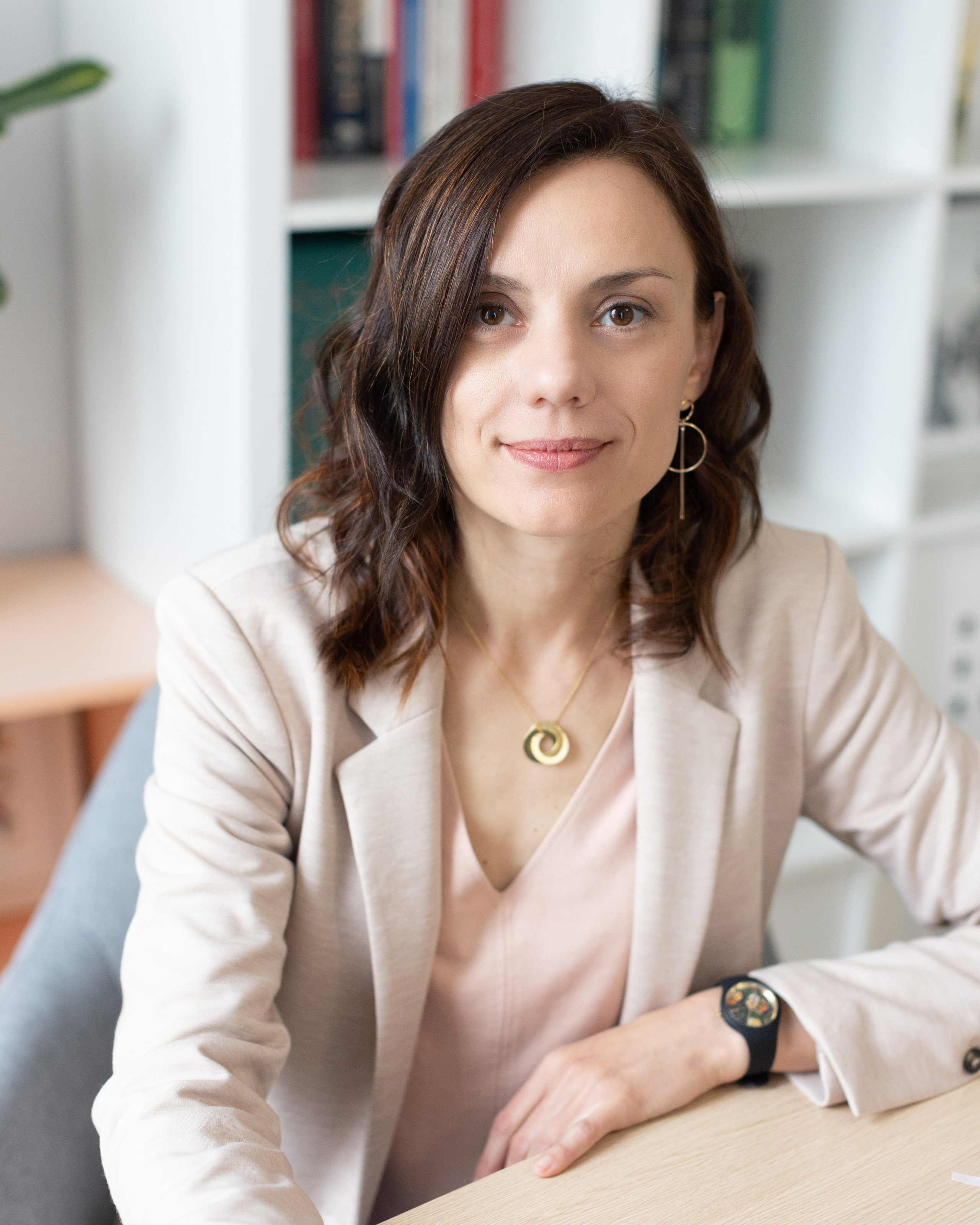 Professional portrait of a female consultant at her desk