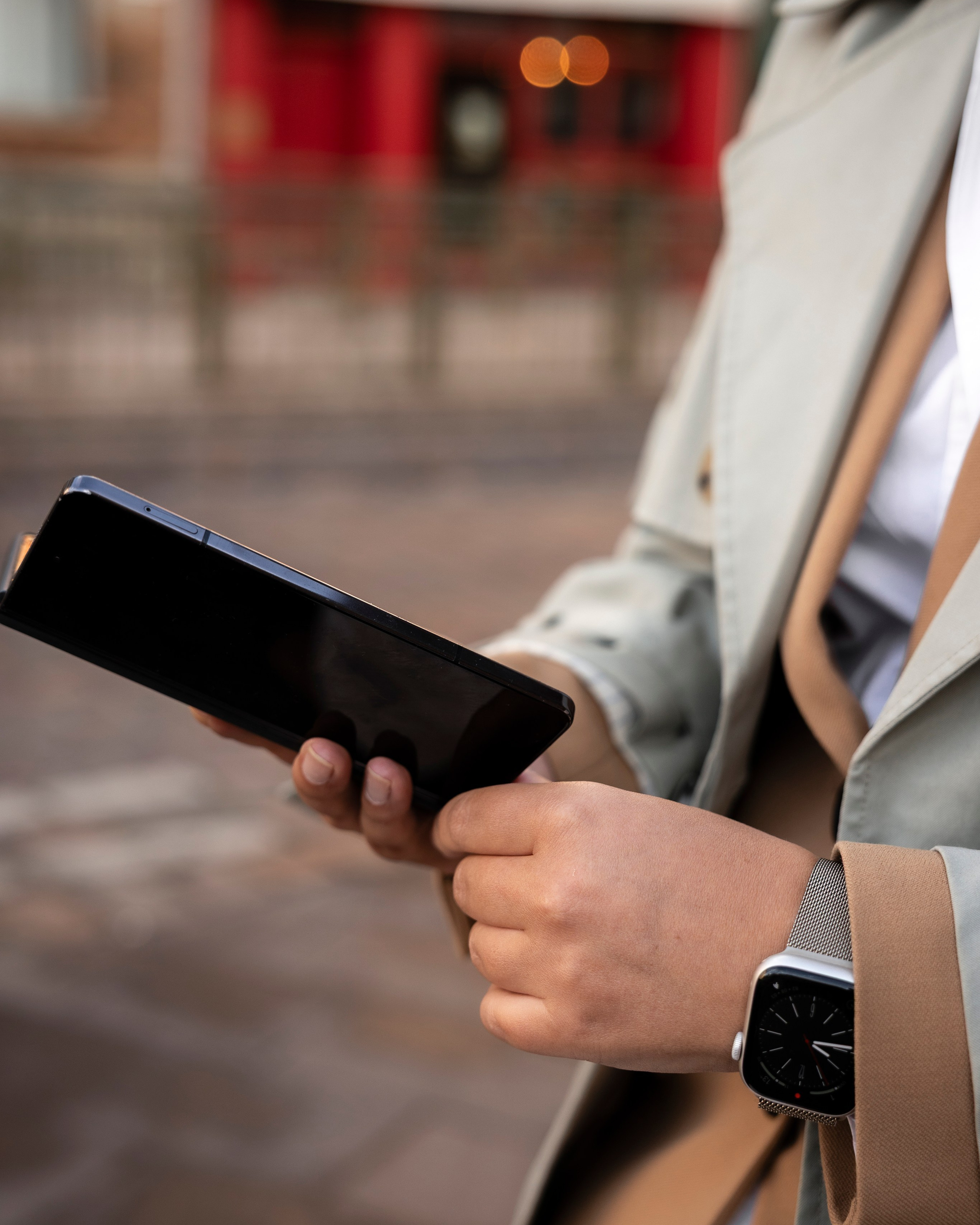 Detail of hands holding a phone during a personal brand session