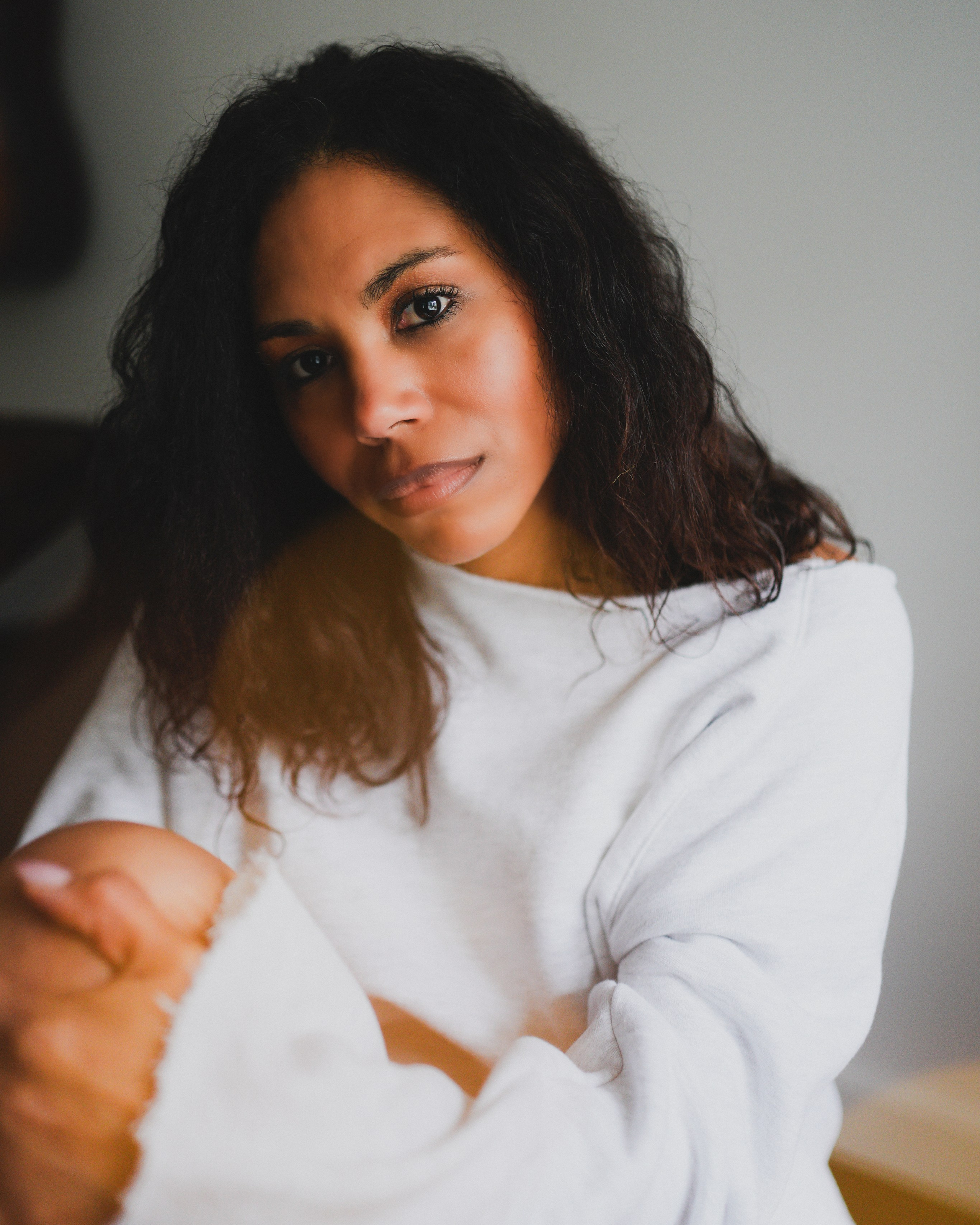 Triptych of an art photo session at the Brean beach. Blue man with hands up.