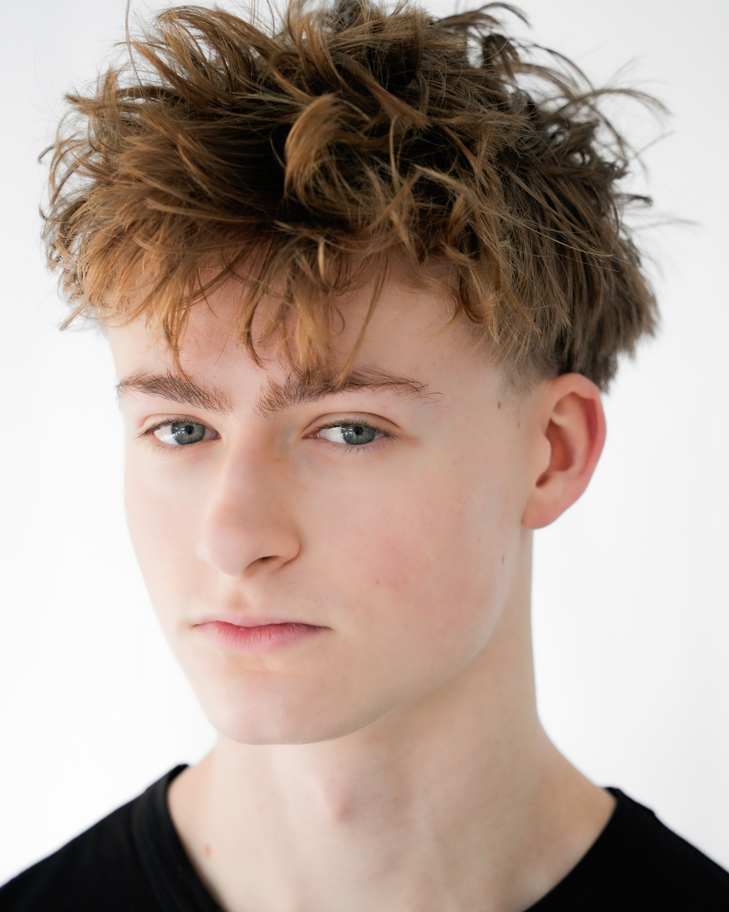 Professional headshot of a young man photographed in natural light in Solihull