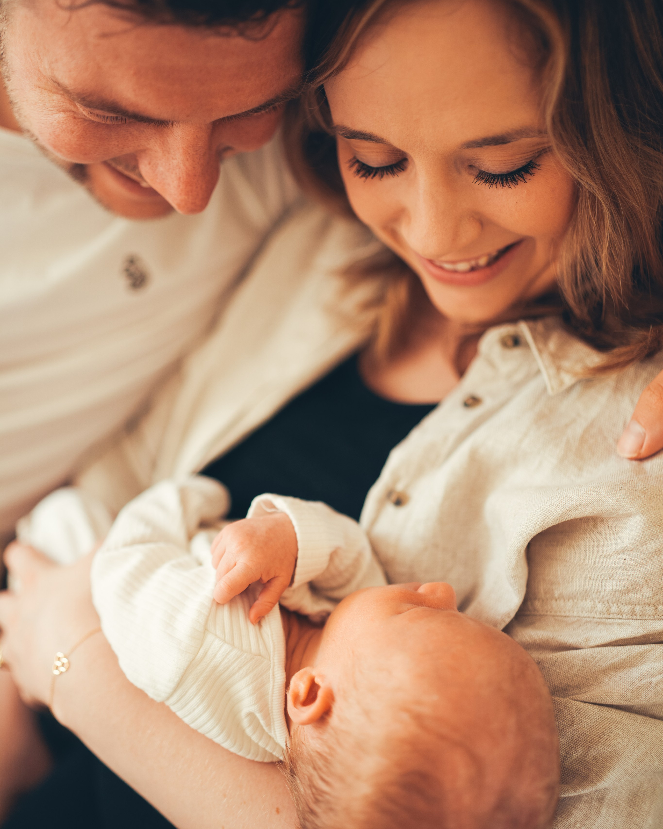 Triptych family with a newborn from a photoshoot at home. Solihull Family Photographer. A maternity photographer near me. Newborn lifestyle home photography. Newborn photography near me.