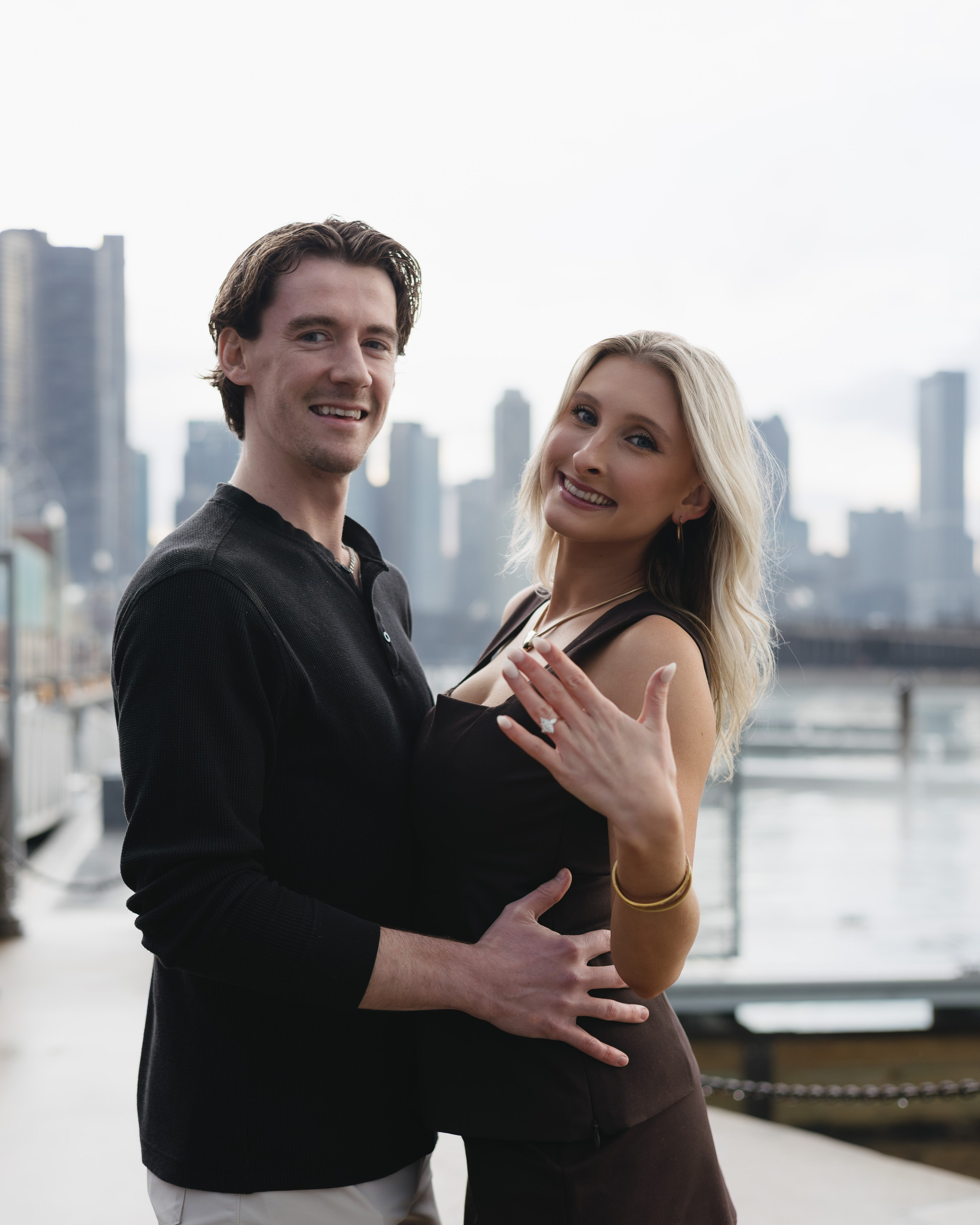 Close-up of a couple’s hands with an engagement ring after a proposal in Chicago